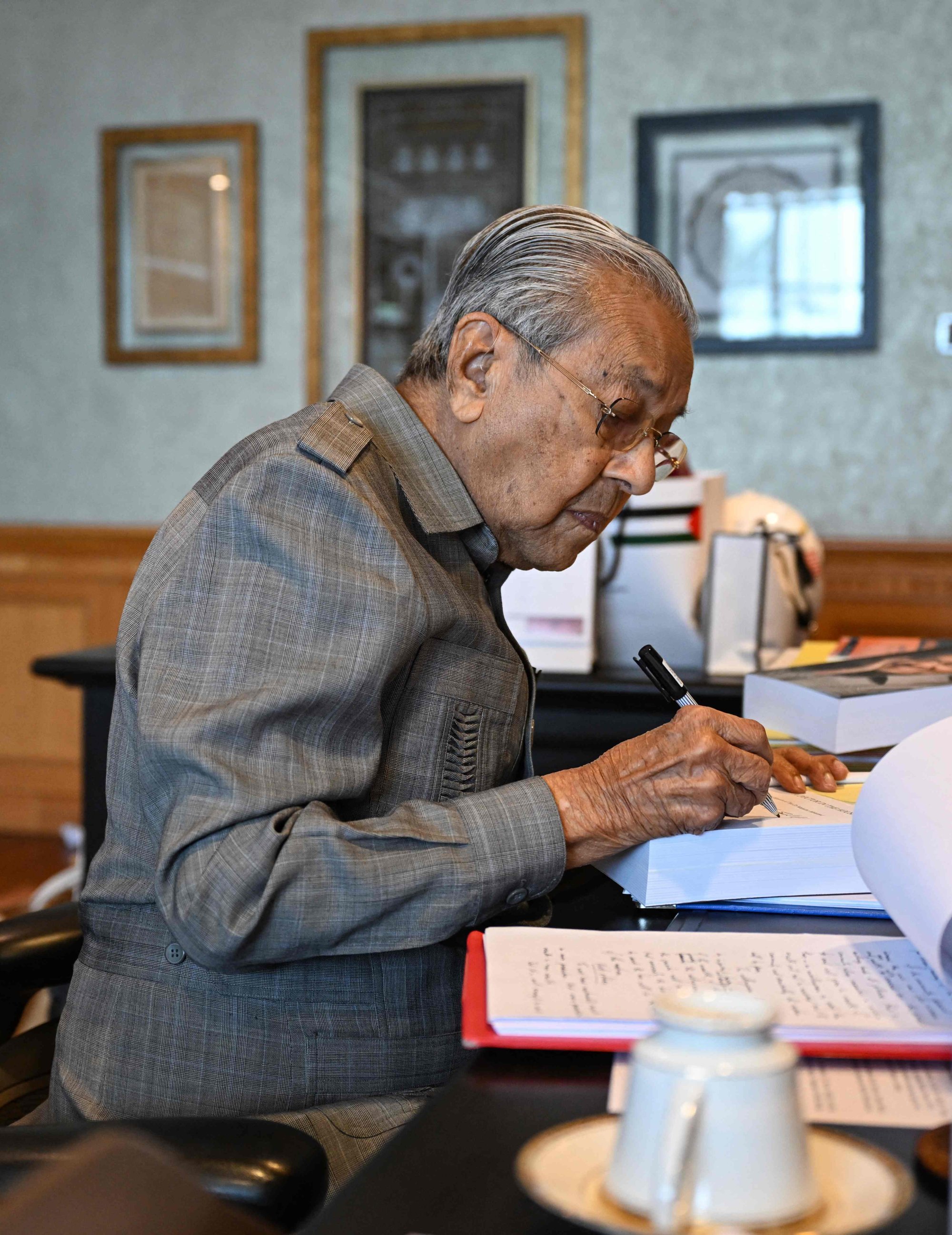 Malaysia’s former prime minister Mahathir Mohamad working at his office in Putrajaya. In February, the 99-year-old’s X account was hacked and started promoting cryptocurrency. Photo: AFP Malaysia’s former prime minister Mahathir Mohamad working at his office in Putrajaya. In February, the 99-year-old’s X account was hacked and started promoting cryptocurrency. Photo: AFP