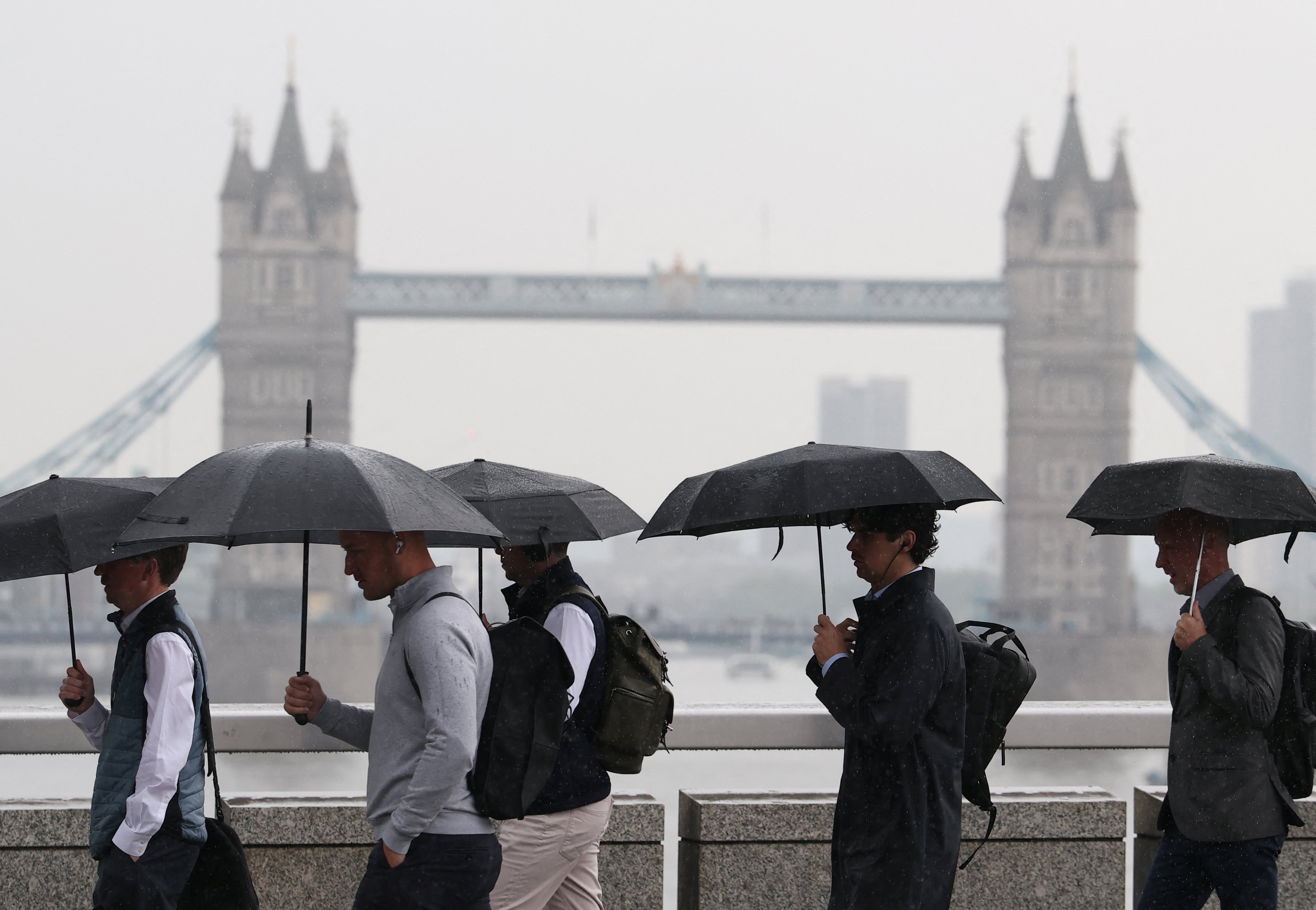 Workers during morning rush-hour in London. Photo: Reuters