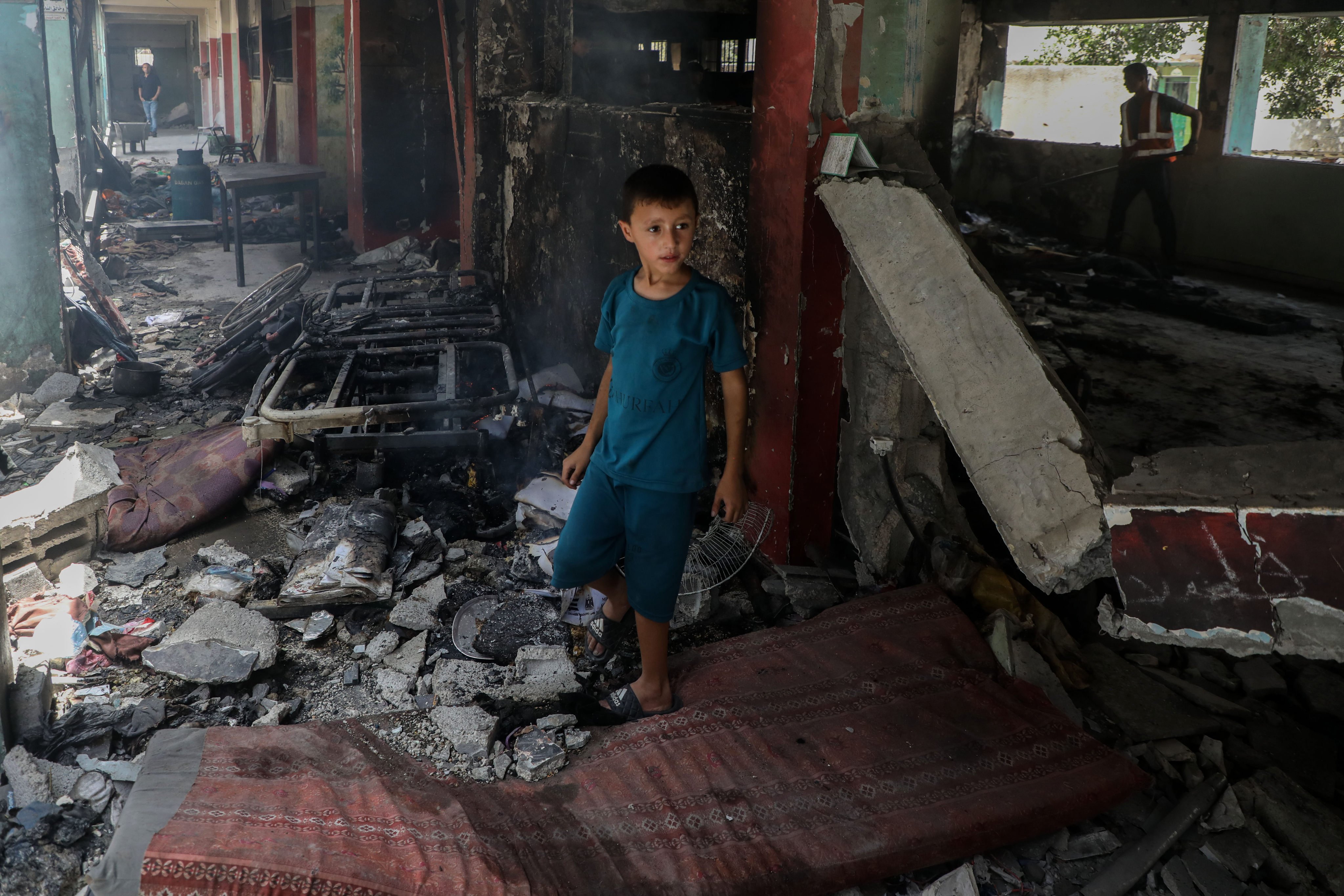 A Palestinian boy is seen at the Fahmi Al-Jarjawi school after an Israeli airstrike in Gaza on May 26, 2025. Photo: Xinhua
