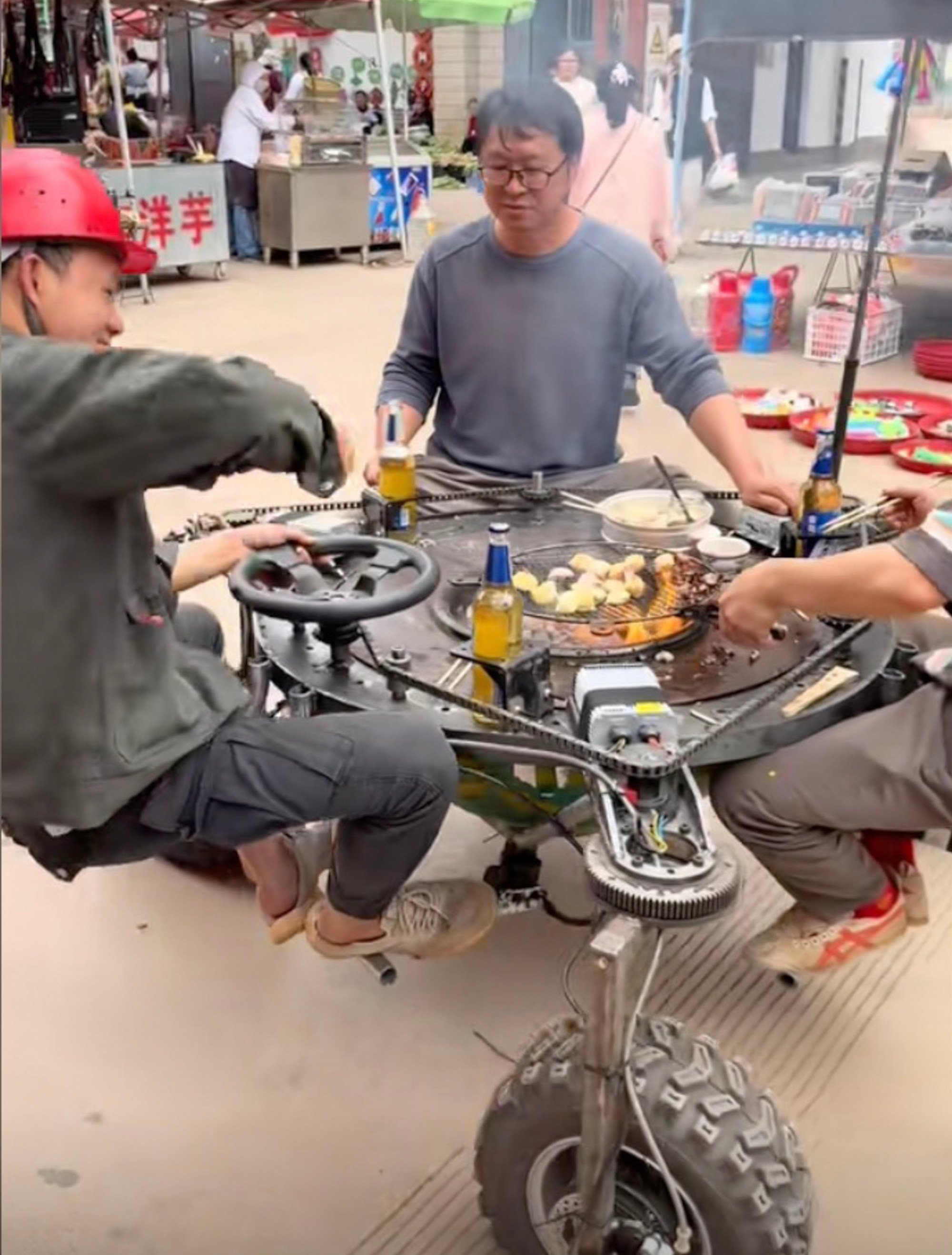 Using discarded materials such as scrap steel, second-hand motorcycle parts, and construction debris, he has completed 300 vehicles, including a BBQ grill table on wheels, above. Photo: Douyin