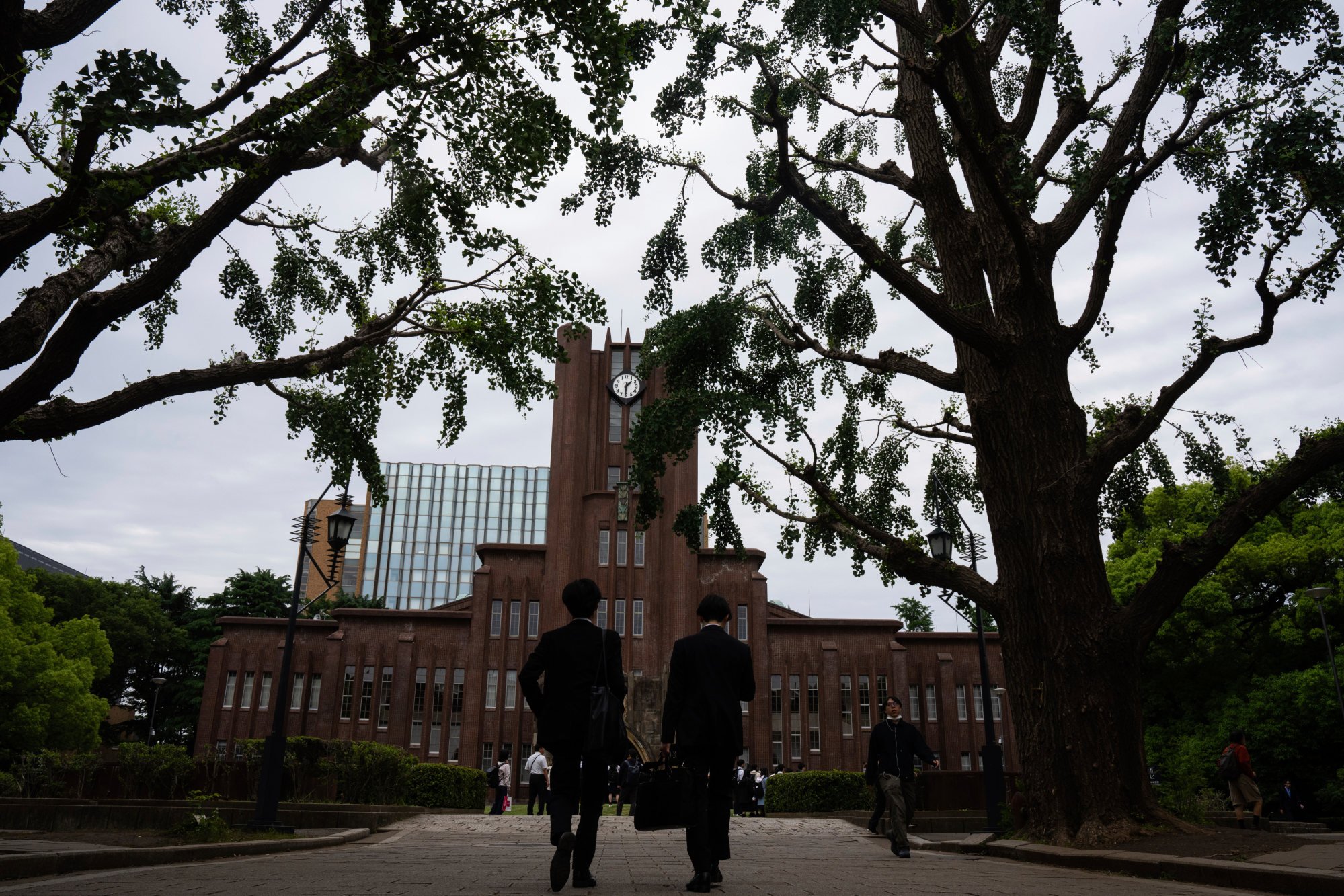 People walk along a road at the University of Tokyo on Tuesday. Photo: AP People walk along a road at the University of Tokyo on Tuesday. Photo: AP