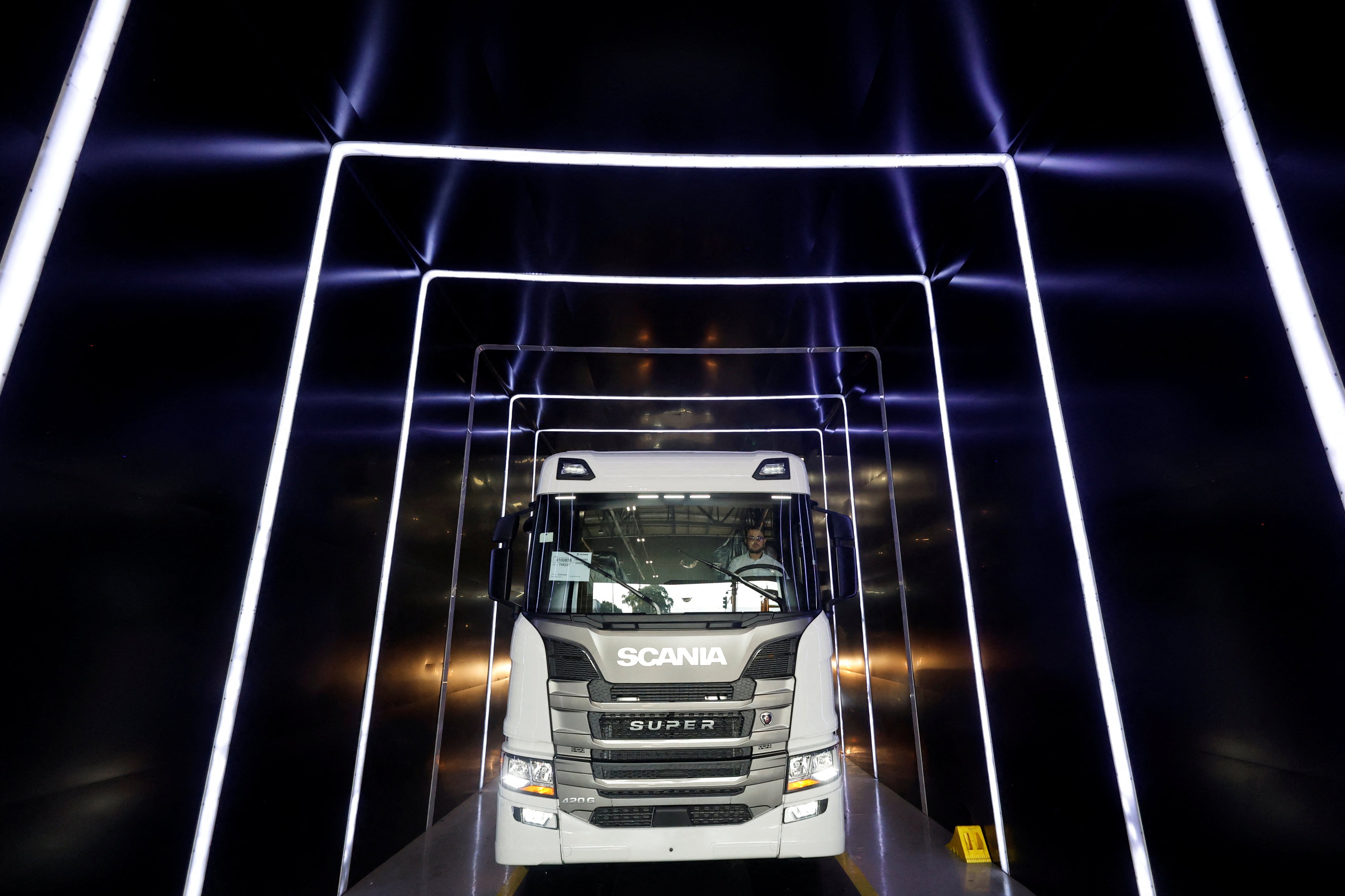 A worker drives a new truck off a manufacturing line at Scania’s plant in Sao Bernardo do Campo in the state of Sao Paulo, Brazil, on May 19, 2025. Photo: Reuters