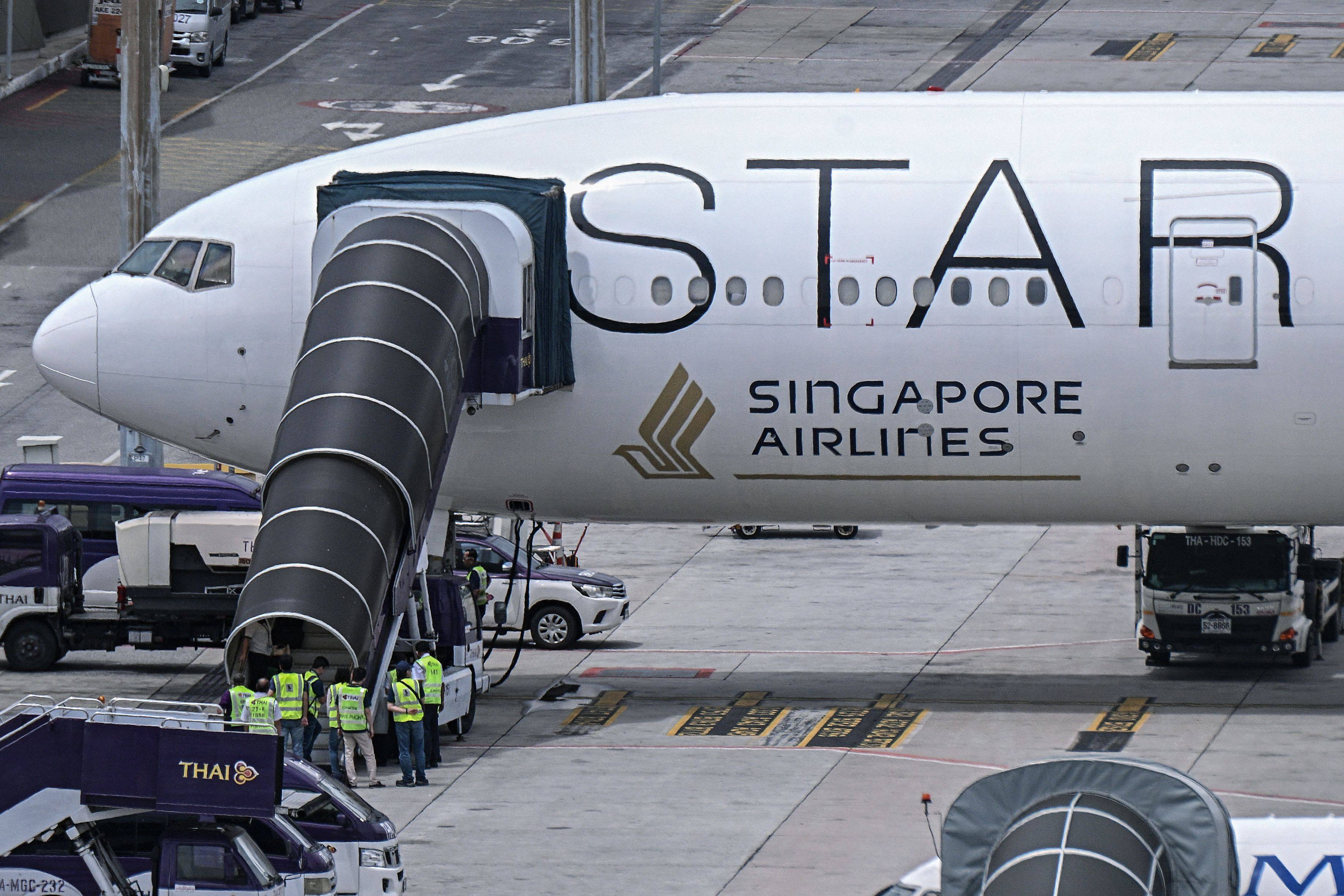 Officials enter the turbulence-hit Singapore Airlines plane at Suvarnabhumi airport in Bangkok last year. Photo: AFP