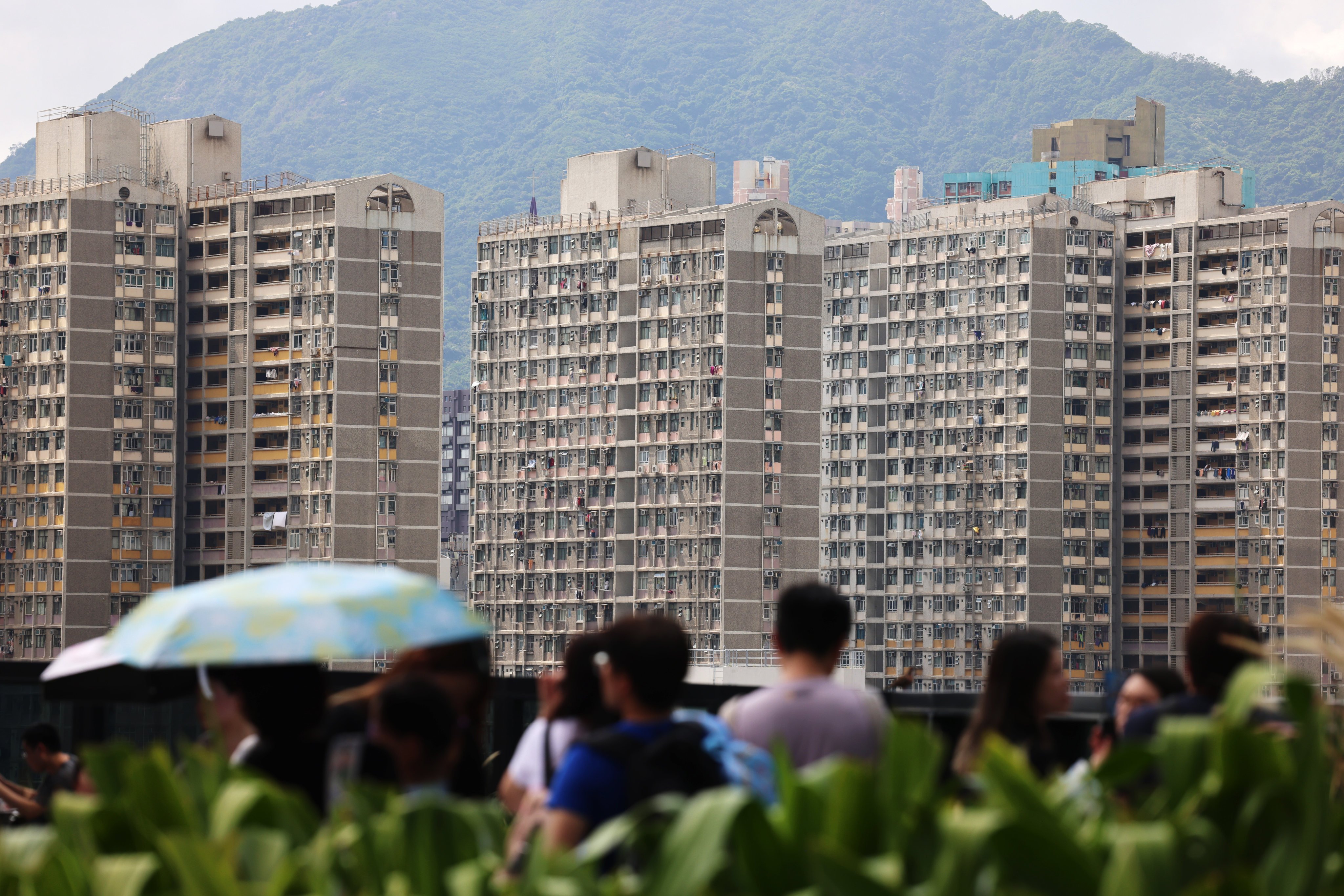 People at a shopping centre in Kai Tak with the public housing estate in the background on 24 April 2025. Photo: Jelly Tse