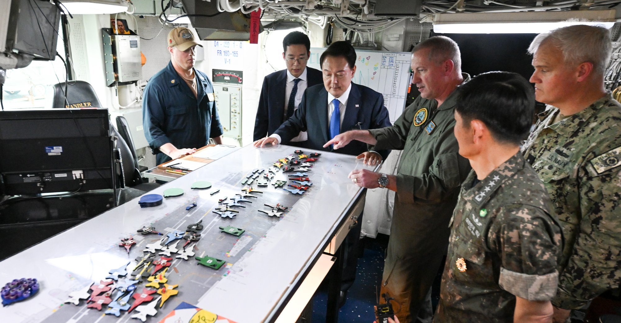 Former South Korean president Yoon Suk-yeol (third from left) on board the nuclear-powered aircraft carrier USS Theodore Roosevelt at Busan naval base last year. Photo: South Korean Presidential Office/EPA-EFE Former South Korean president Yoon Suk-yeol (third from left) on board the nuclear-powered aircraft carrier USS Theodore Roosevelt at Busan naval base last year. Photo: South Korean Presidential Office/EPA-EFE