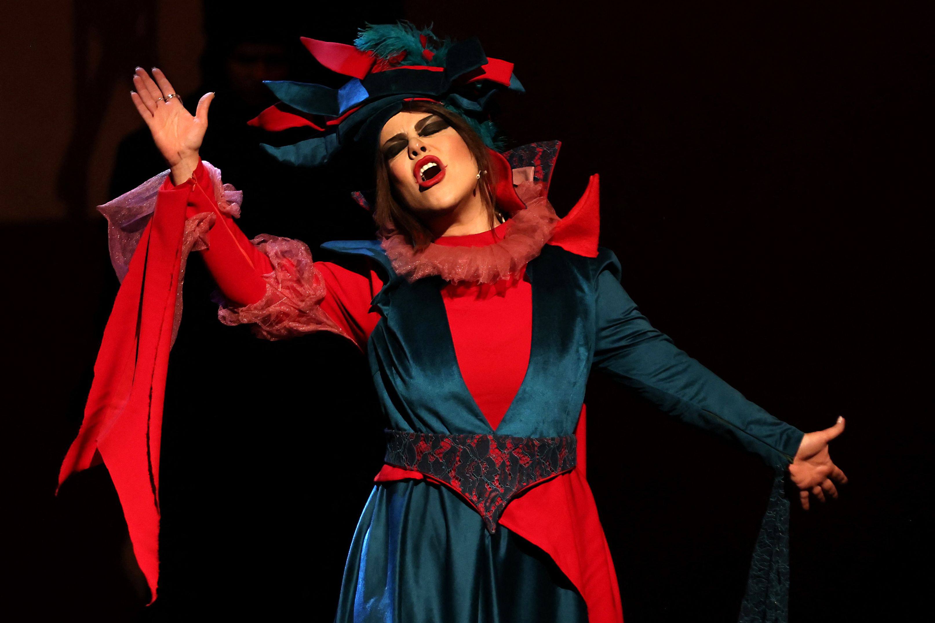 An actress performs during a presentation of William Shakespeare’s “King Lear”, directed by Iranian actress and director Elika Abdolrazzaghi, at Tehran’s Shahr Theatre, on May 21, 2025. (Photo by ATTA KENARE / AFP)