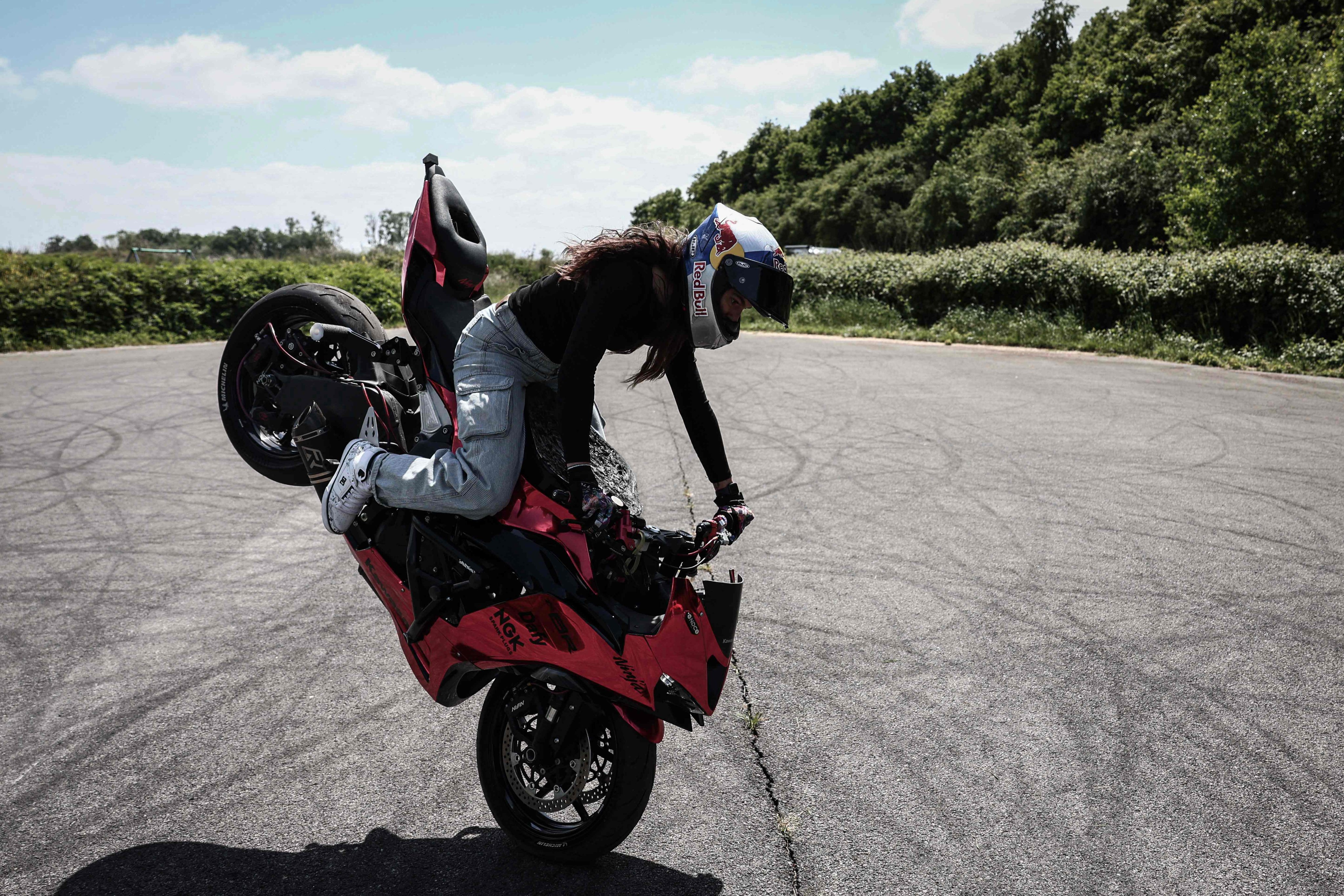 French stunt rider Sarah Lezito performs a stoppie on her Kawasaki Ninja ZX-6R. Photo: AFP