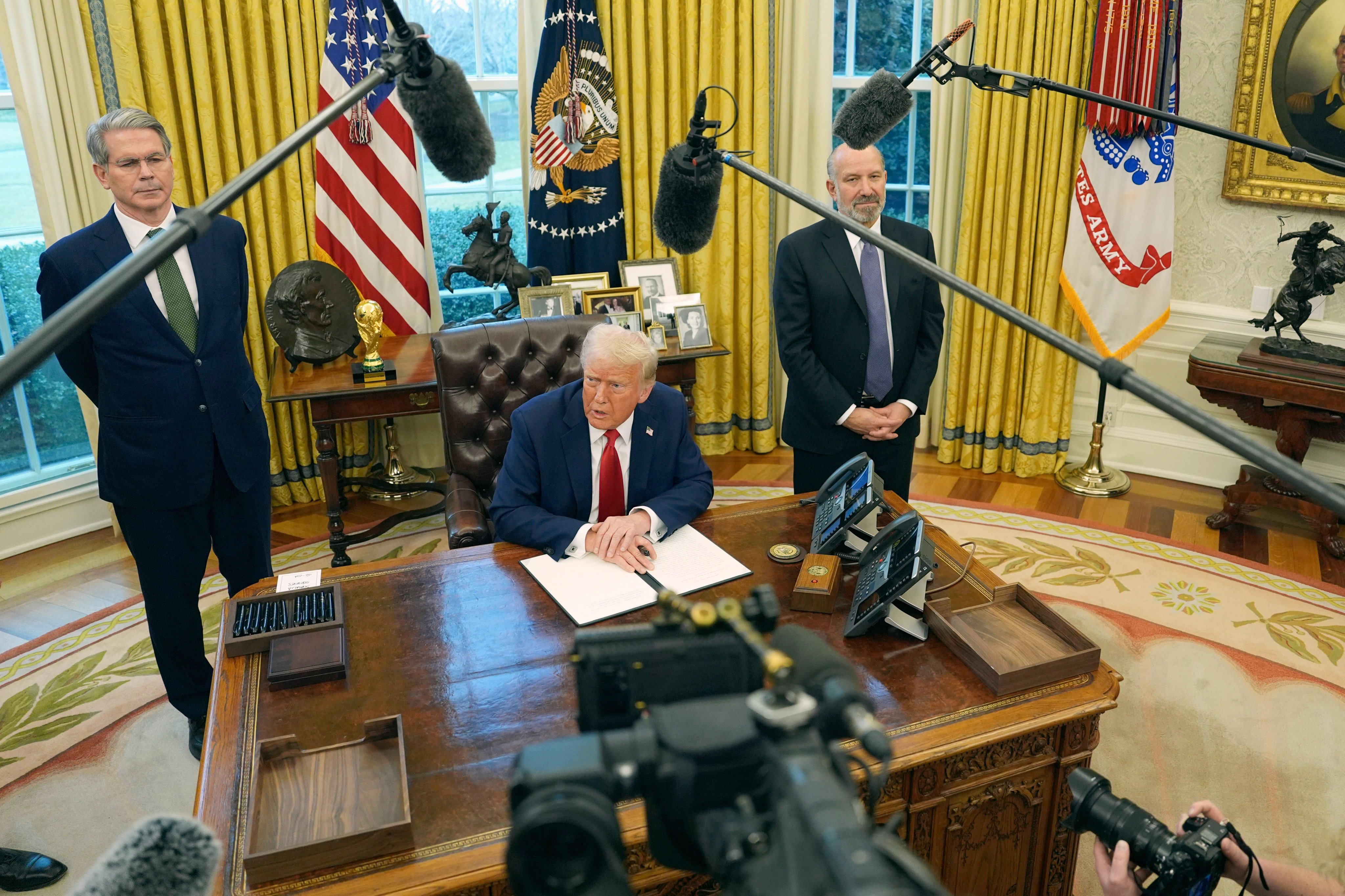 US President Donald Trump (centre) with two of his administration’s top officials, Treasury Secretary Scott Bessent (left) and Commerce Secretary Howard Lutnick. Photo: AP