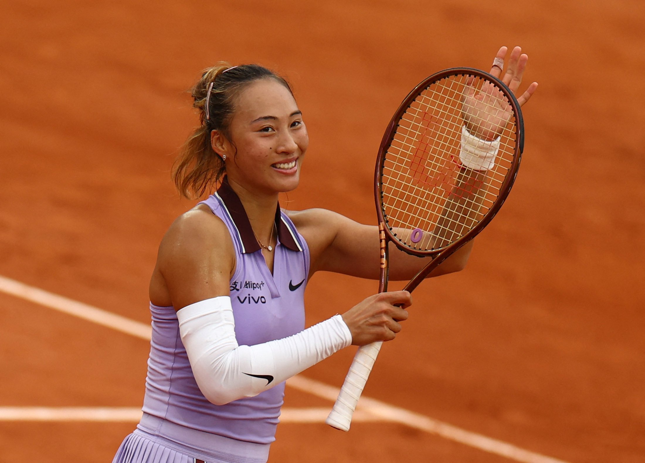 China’s Zheng Qinwen acknowledges the crowd after winning her second-round match against Colombia’s Emiliana Arango. Photo: Reuters