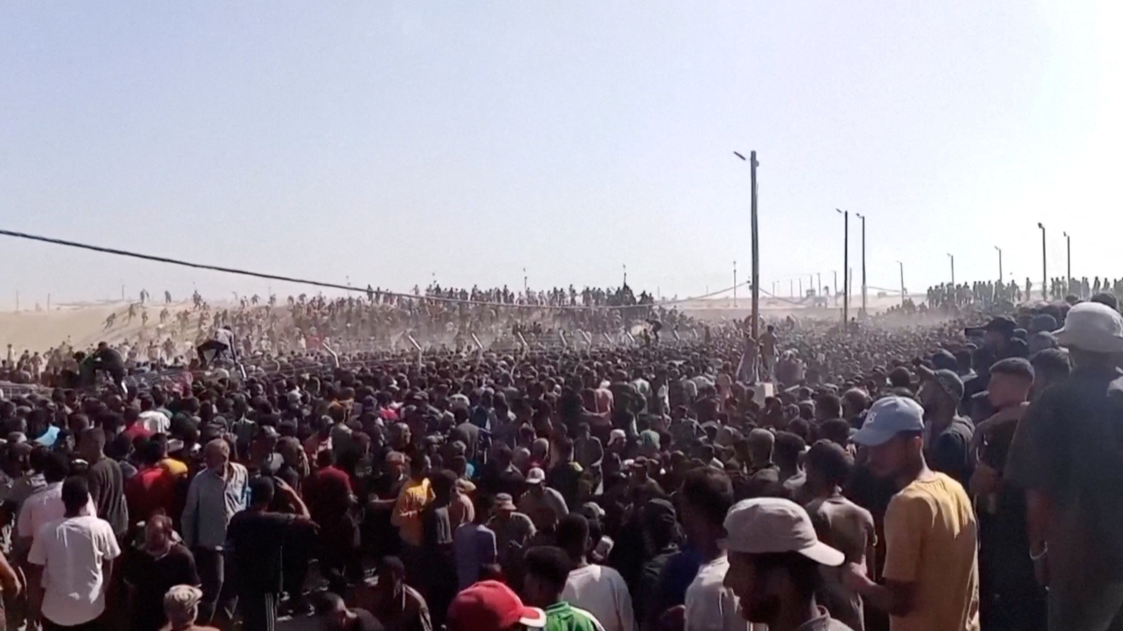 Palestinians rush to get aid boxes in Rafah, in the southern Gaza Strip, on Tuesday. Photo: Reuters