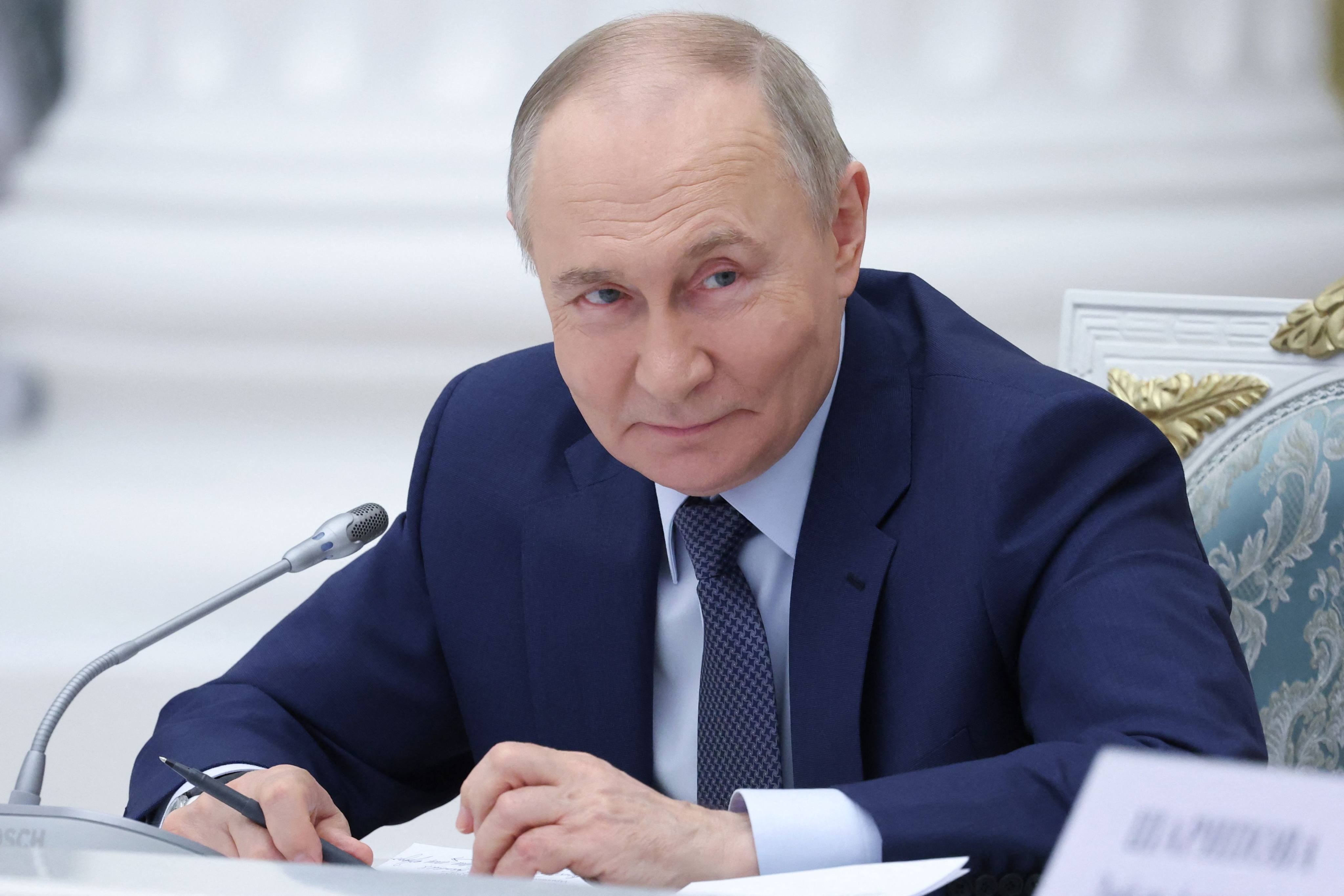 Russia’s President Vladimir Putin chairs a meeting in Moscow on Tuesday. Photo: Sputnik via AFP