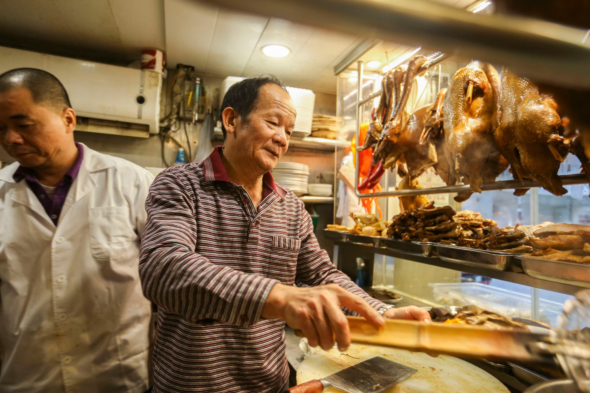 Staff work in a Chiuchow, or Teochew, restaurant in North Point in Hong Kong in 2017. Teochew people are historically from Chaozhou, an erstwhile prefecture in Guangdong, and have their own dialect and cuisine. Photo: Xiaomei Chen Staff work in a Chiuchow, or Teochew, restaurant in North Point in Hong Kong in 2017. Teochew people are historically from Chaozhou, an erstwhile prefecture in Guangdong, and have their own dialect and cuisine. Photo: Xiaomei Chen