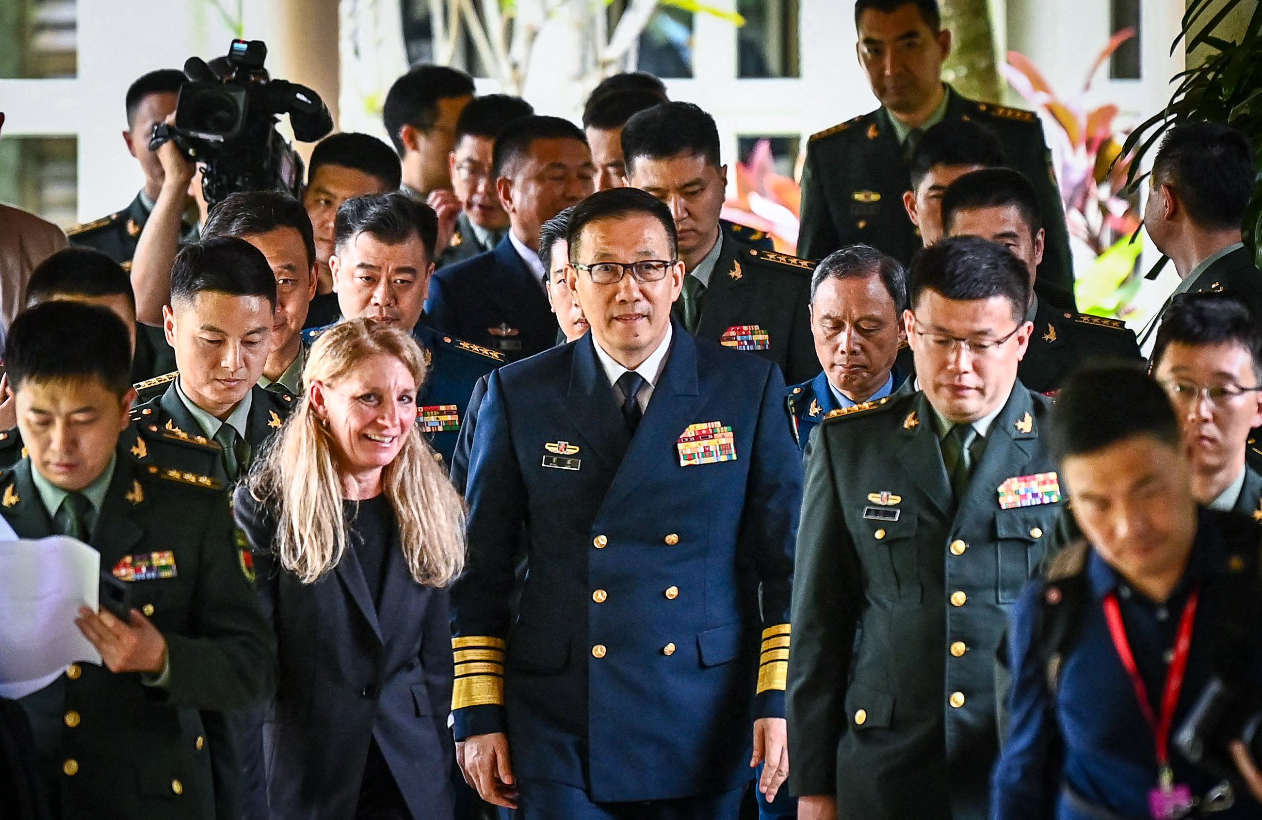 Chinese Defence Minister Dong Jun (centre) walks out following a bilateral meeting with then US Defence Secretary Lloyd Austin on the sidelines of the 21st Shangri-La Dialogue in Singapore on May 31 of last year. Photo: AFP