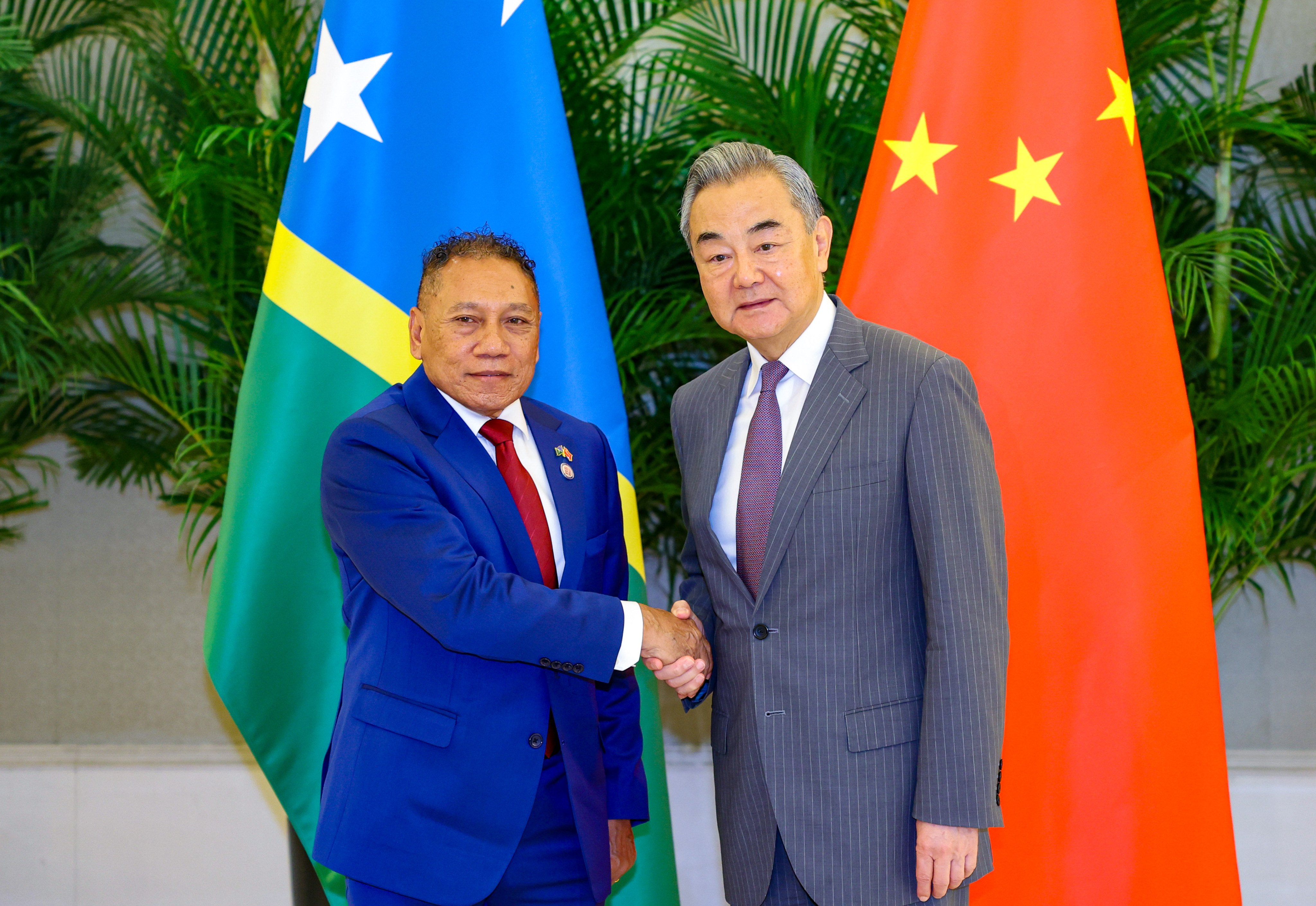 Solomon Islands’ Peter Shanel Agovaka (left) and top Chinese diplomat Wang Yi at the China-Pacific Island Countries foreign ministers’ meeting in Xiamen on Wednesday. Photo: Xinhua