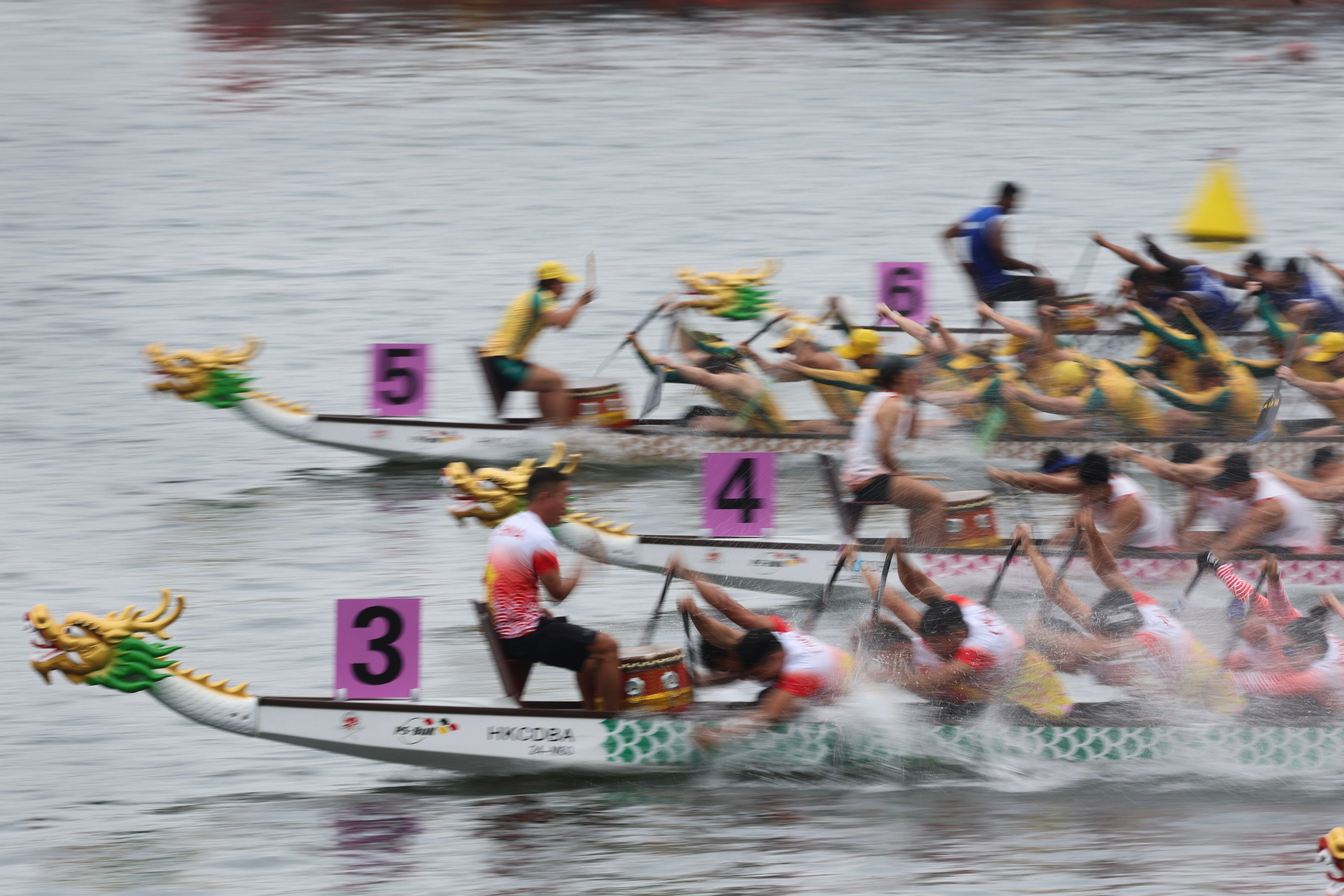 Dragon boat teams cross the finish line at the end of a race in Hong Kong’s Victoria Harbour in 2024. Dragon boat racing is one of the traditions of the Duanwu Festival, or Tuen Ng Festival, said to have arisen from the death of poet Qu Yuan in ancient China. Photo: Dickson Lee