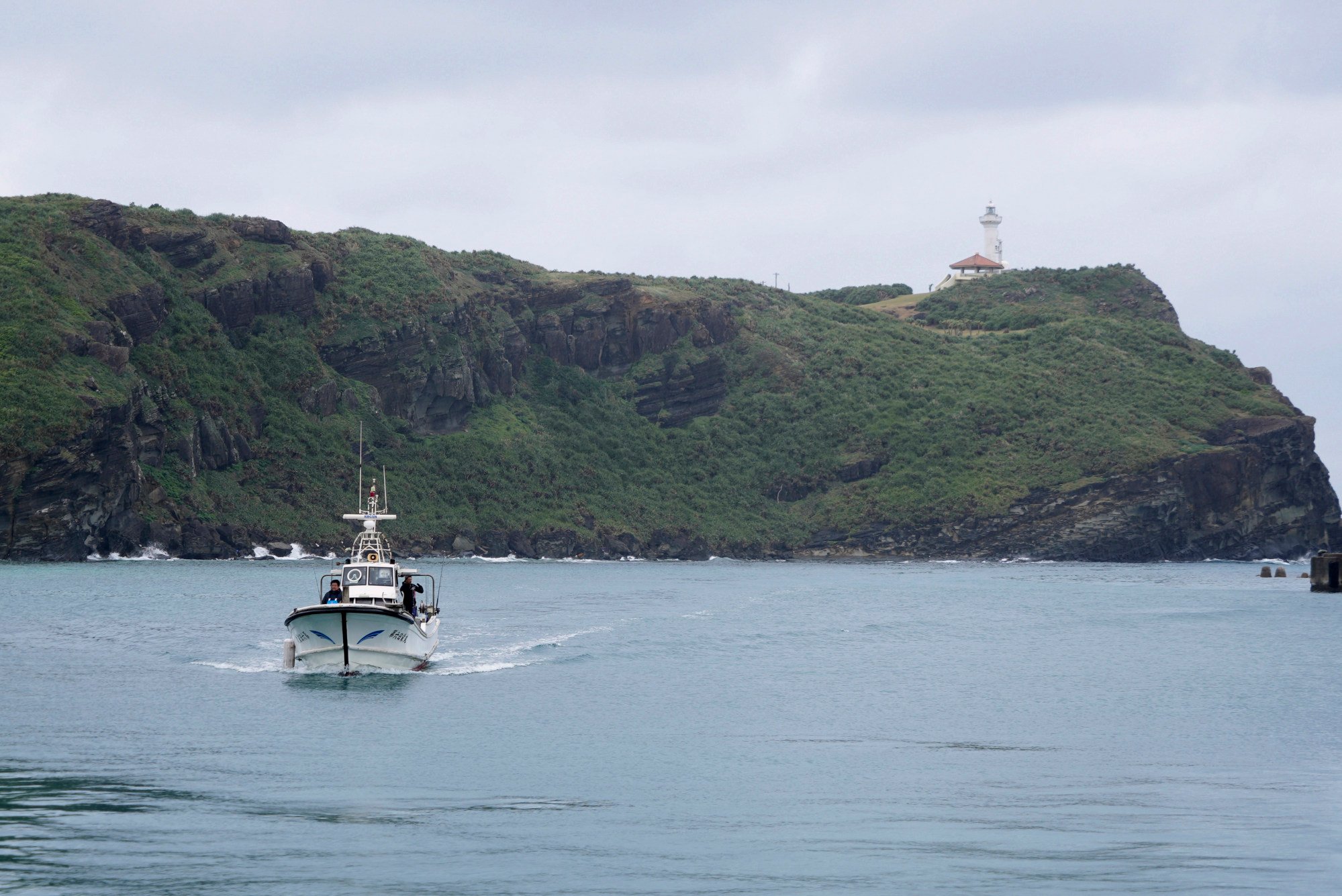 A fishing boat returns from a catch on Yonaguni, a tiny island on Japan’s western frontier, in February. China has recently removed a buoy south of Yonaguni, the Japanese government has confirmed. Photo: AP A fishing boat returns from a catch on Yonaguni, a tiny island on Japan’s western frontier, in February. China has recently removed a buoy south of Yonaguni, the Japanese government has confirmed. Photo: AP