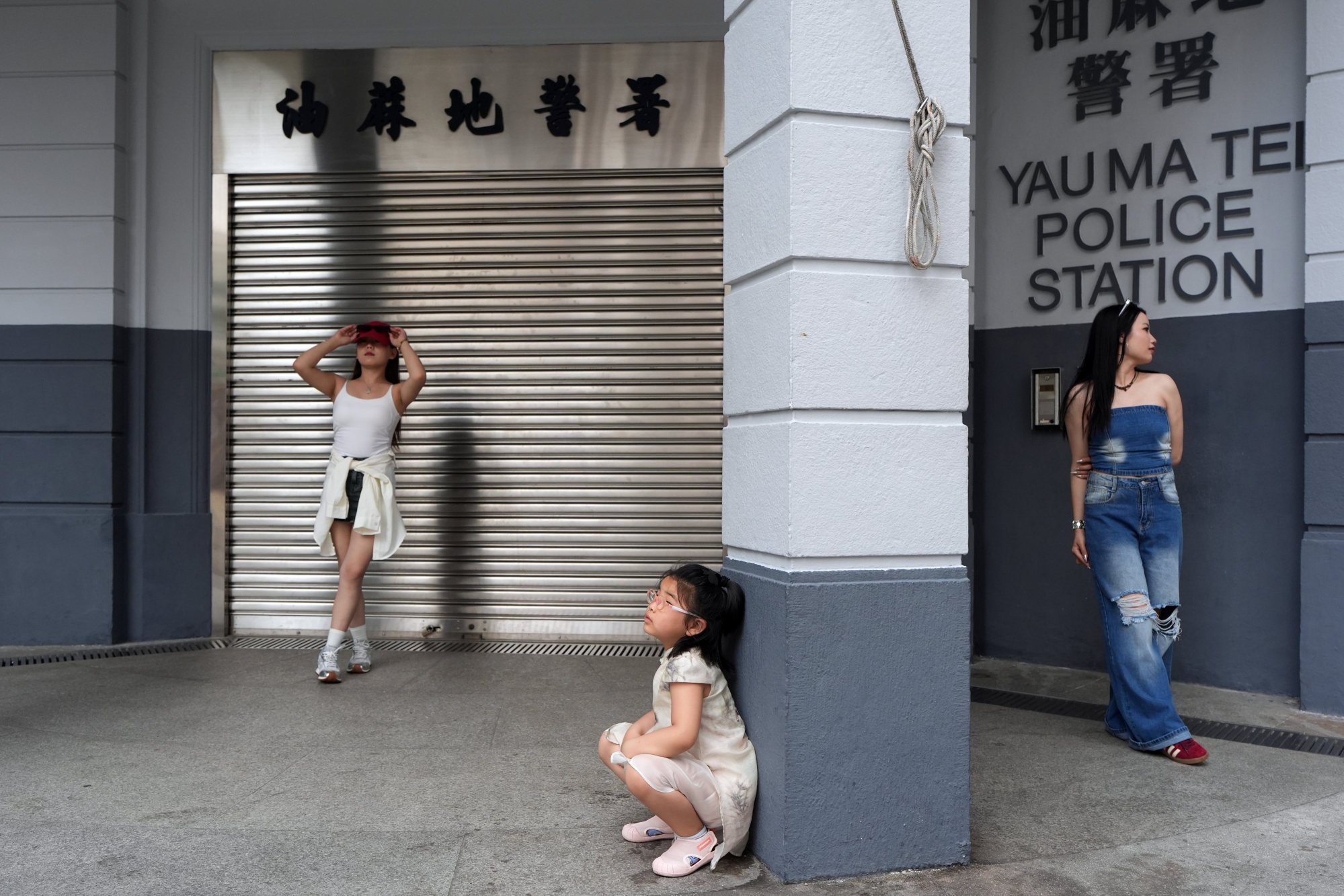 Tourists from mainland China pose for photos at the Yau Ma Tei Police Station in Hong Kong on May 20. The demand for Instagram-able photos pushes travellers towards a more superficial experience. Photo: Eugene Lee Tourists from mainland China pose for photos at the Yau Ma Tei Police Station in Hong Kong on May 20. The demand for Instagram-able photos pushes travellers towards a more superficial experience. Photo: Eugene Lee