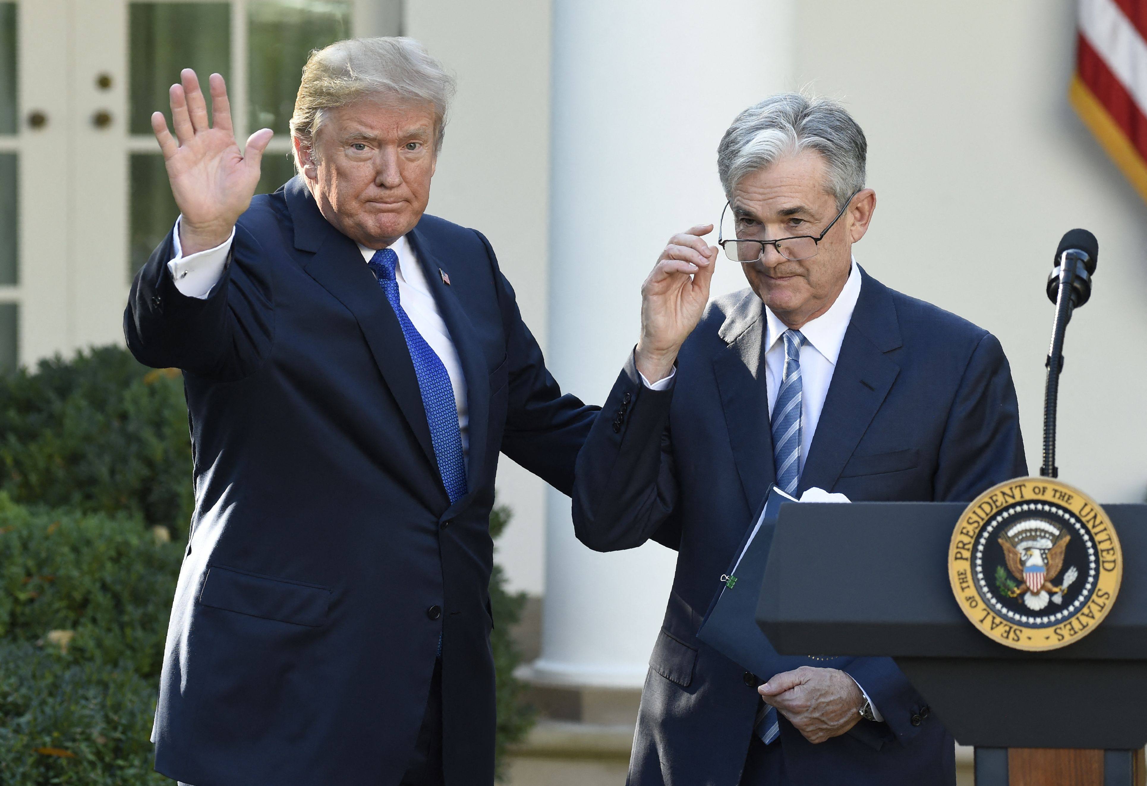 US President Donald Trump (left) signals the end of ceremony after announcing Jerome Powell (right) as nominee for Chairman of the Federal Reserve at the White House in November 2017. Photo: AFP