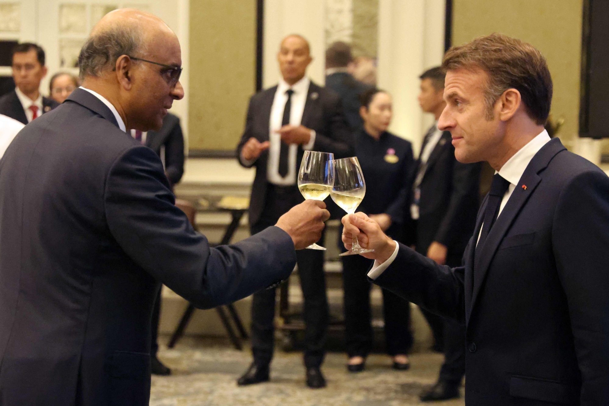 Singapore’s President Tharman Shanmugaratnam (left) makes a toast with France’s President Emmanuel Macron (right) during a state lunch in Singapore on Friday. Photo: AFP Singapore’s President Tharman Shanmugaratnam (left) makes a toast with France’s President Emmanuel Macron (right) during a state lunch in Singapore on Friday. Photo: AFP