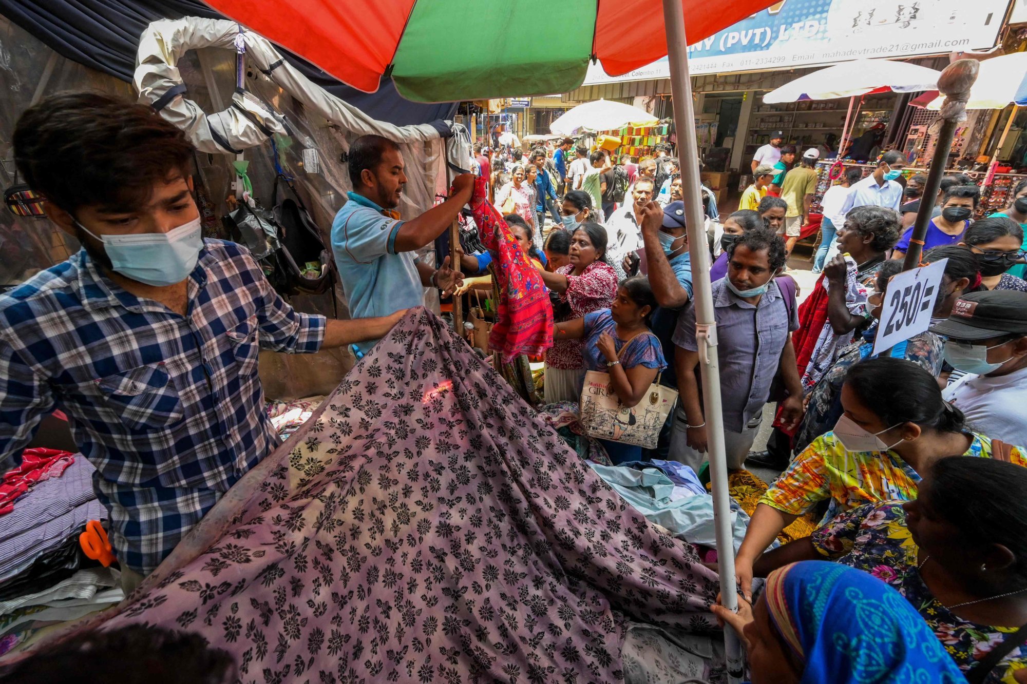 Sri Lankans buy clothes from a roadside stall at a market in Colombo in April 2023. The country’s apparel industry remained resilient throughout the Covid-19 pandemic. Photo: AFP Sri Lankans buy clothes from a roadside stall at a market in Colombo in April 2023. The country’s apparel industry remained resilient throughout the Covid-19 pandemic. Photo: AFP