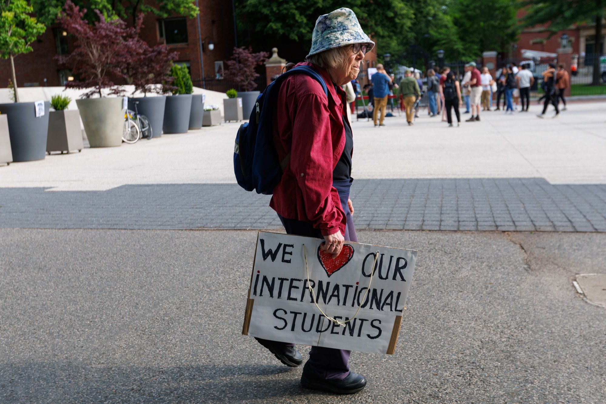 A protestor arrives at a rally in support of Harvard’s international student population at the university’s campus in Cambridge, Massachusetts, on Tuesday. Photo: EPA-EFE A protestor arrives at a rally in support of Harvard’s international student population at the university’s campus in Cambridge, Massachusetts, on Tuesday. Photo: EPA-EFE