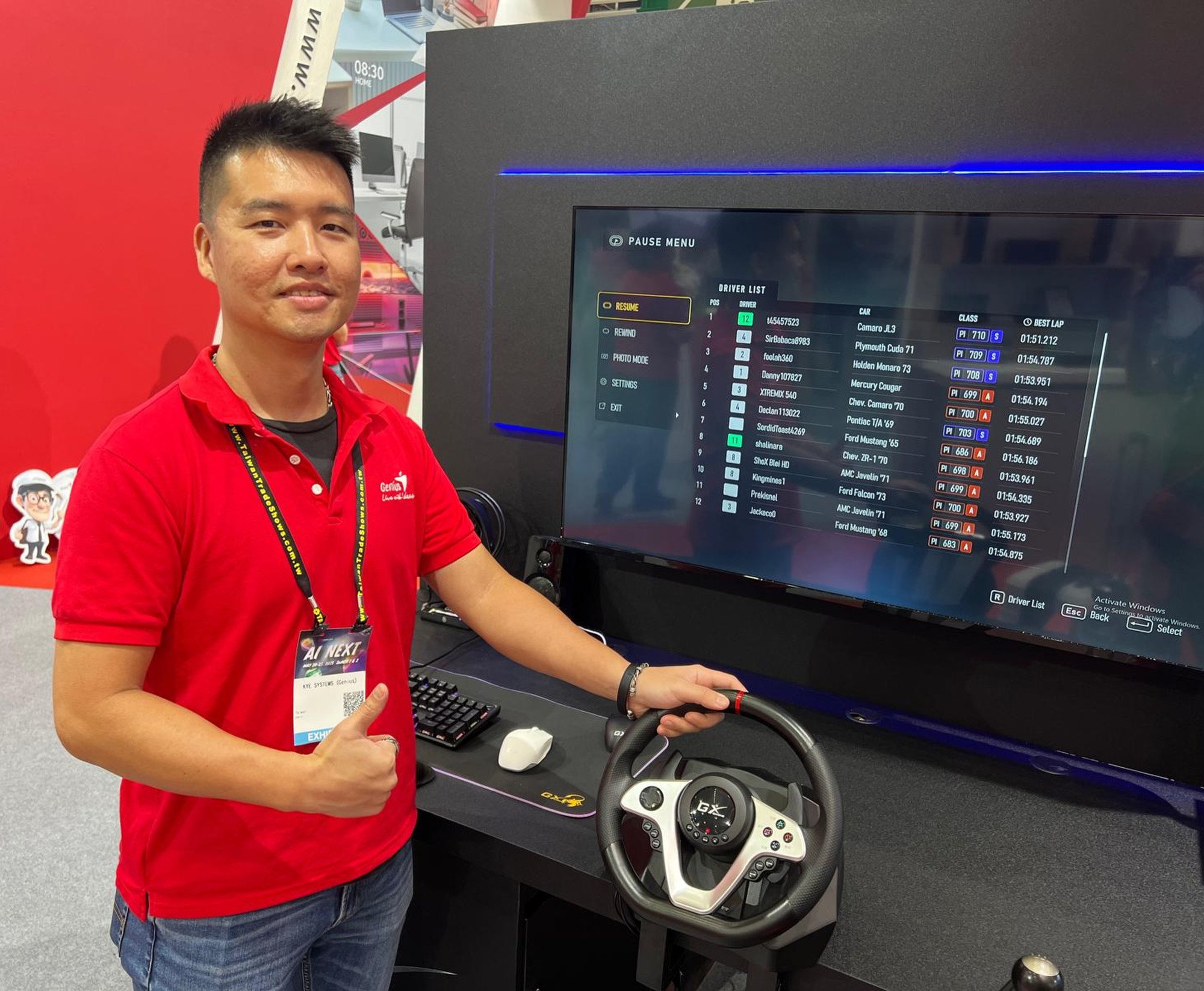Miguel Yeh, a sales representative with Kye Systems, shows a gamer’s steering wheel, made under his company’s brand Genius, at the Computex Taipei 2025 tech show on May 20. Photo: SCMP/Ralph Jennings Miguel Yeh, a sales representative with Kye Systems, shows a gamer’s steering wheel, made under his company’s brand Genius, at the Computex Taipei 2025 tech show on May 20. Photo: SCMP/Ralph Jennings