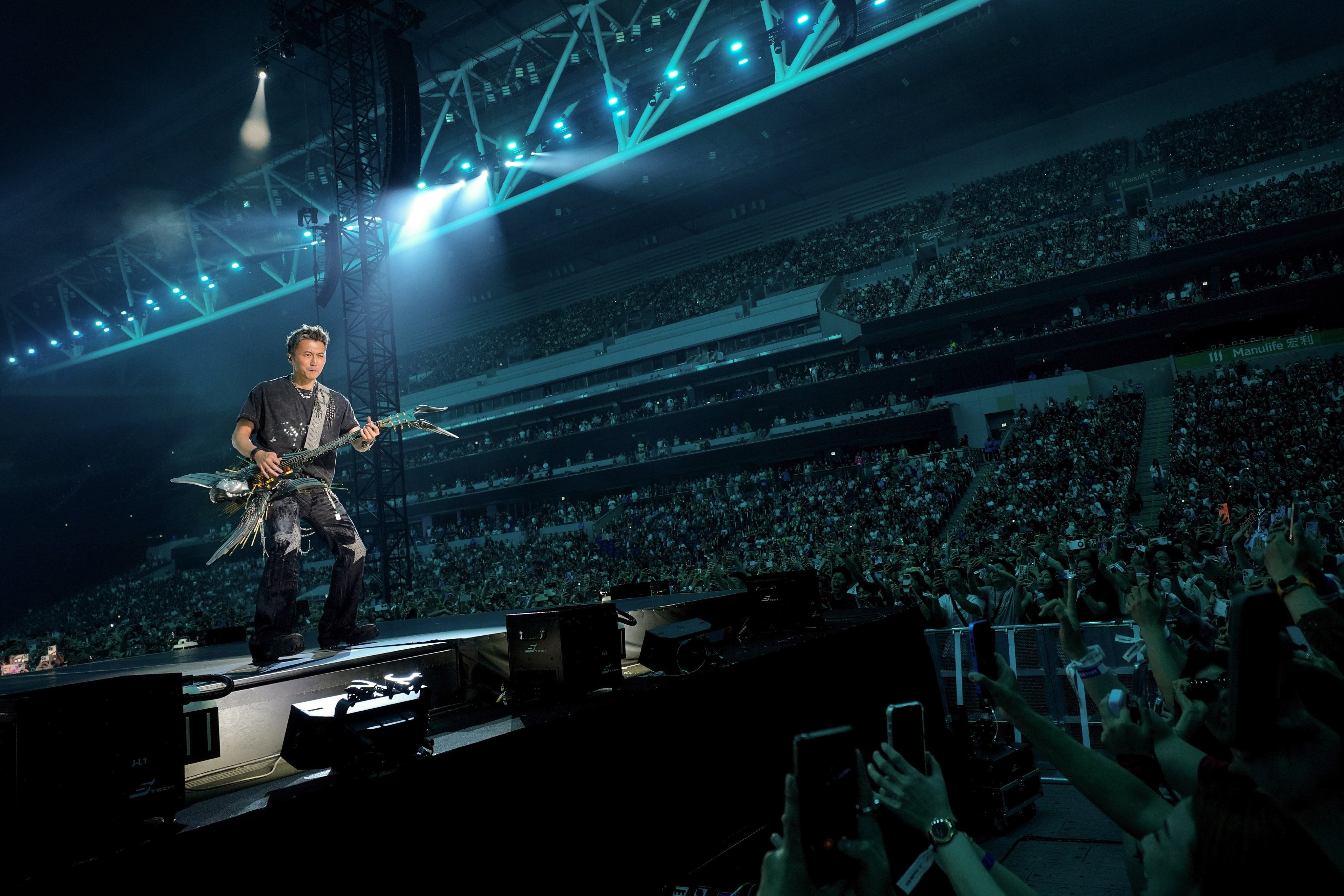 Cantopop star Nicholas Tse entertains his fans at Kai Tak Stadium. Photo: Elson Li