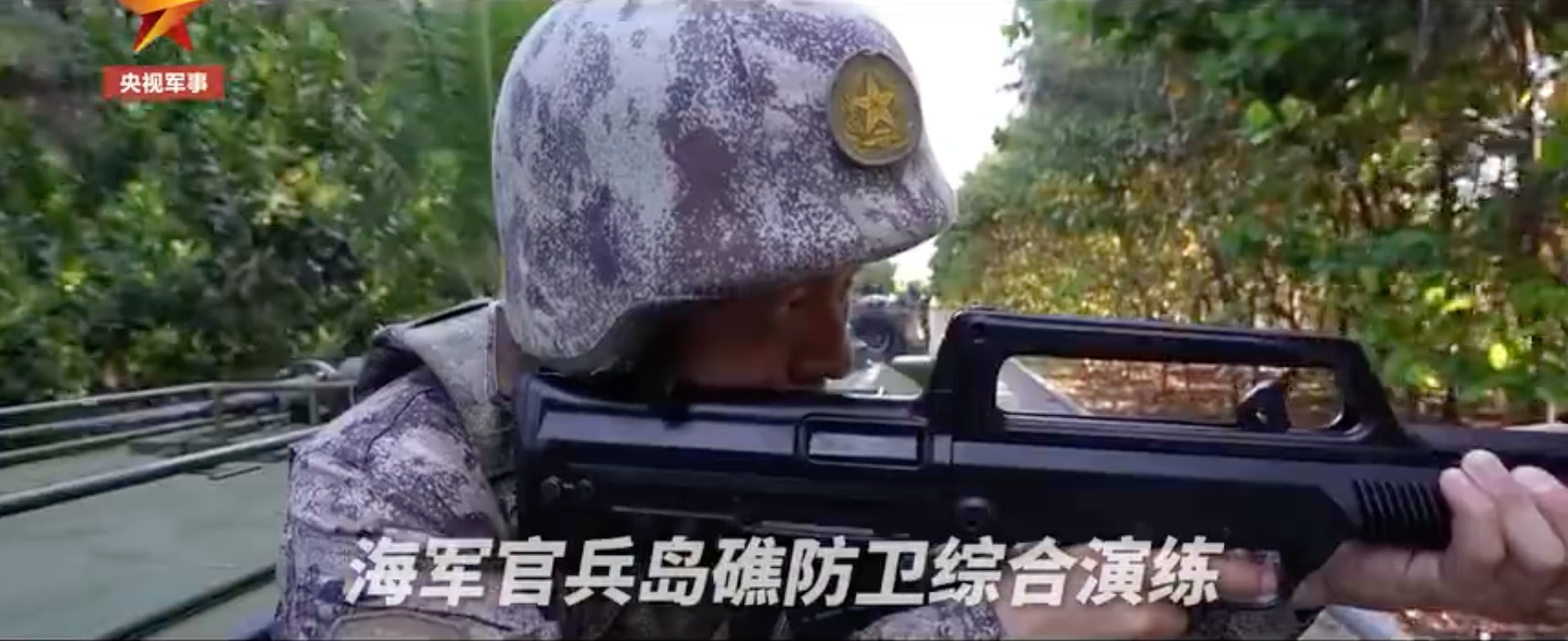 Footage aired by state broadcaster CCTV on Friday shows an island defence drill on a disputed reef in the South China Sea. Photo: CCTV