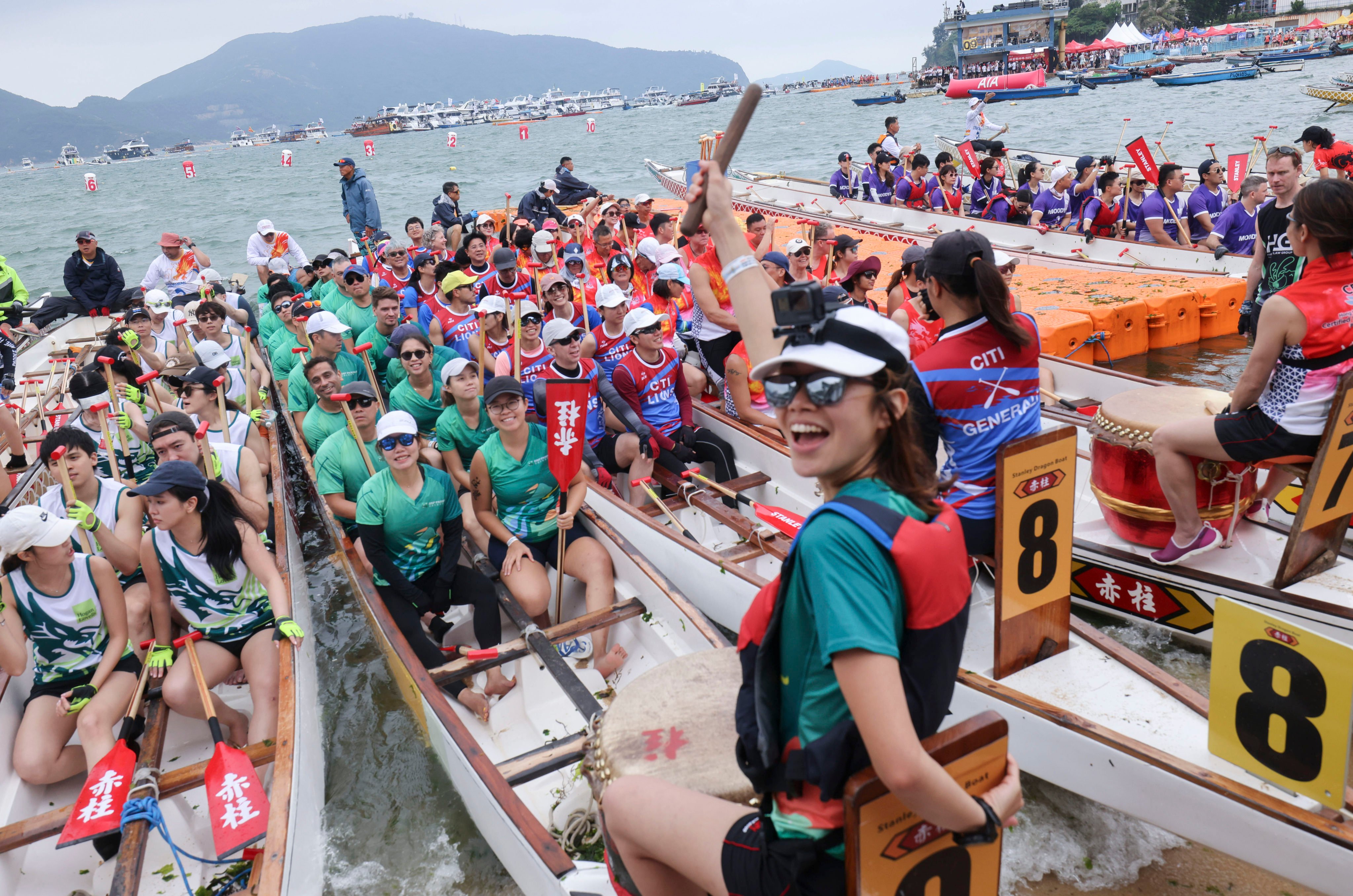 Dragon boat paddlers race in Stanley. Photo: Nora Tam