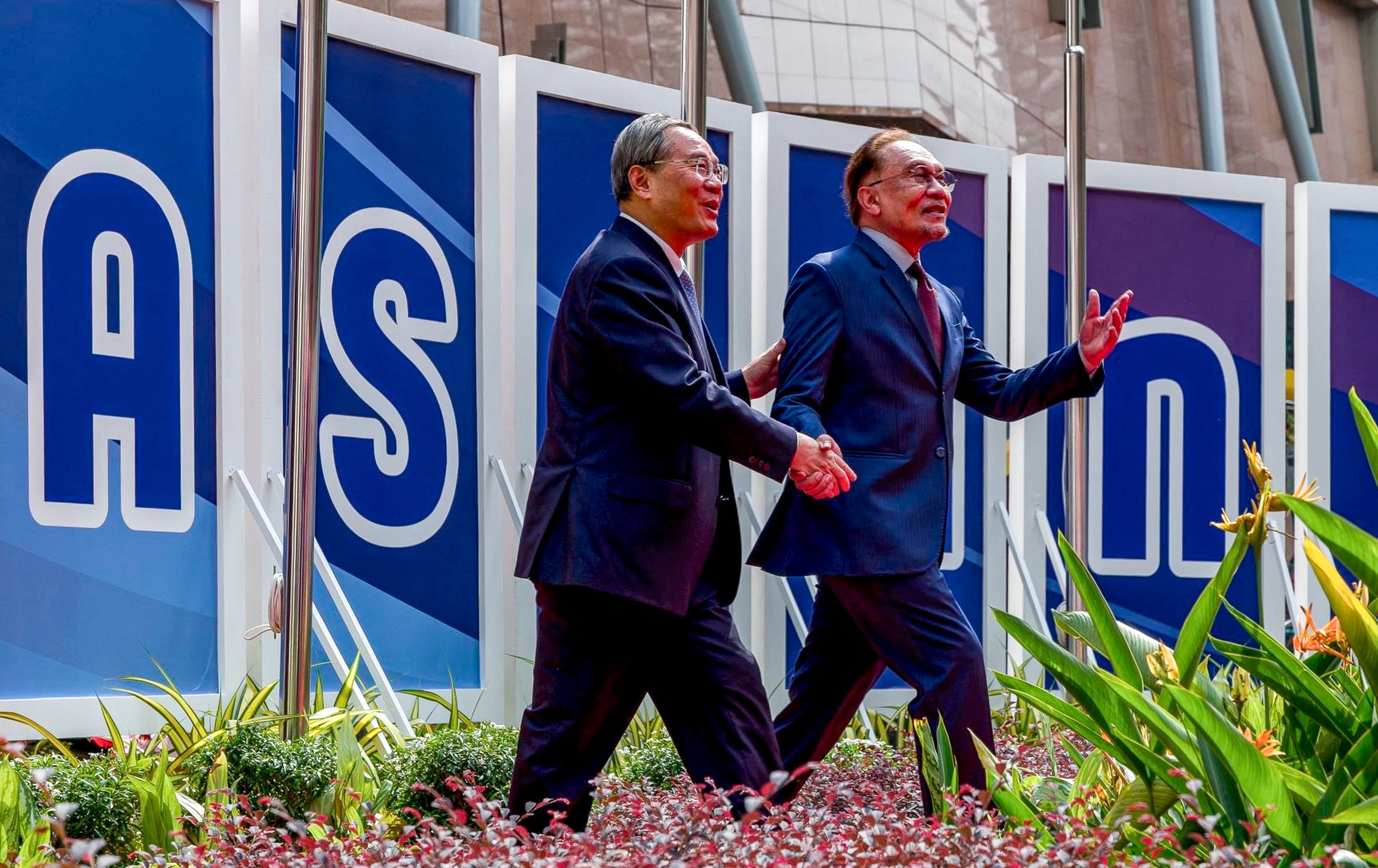 Malaysia’s Prime Minister Anwar Ibrahim (right) gestures as he welcomes China’s Premier Li Qiang ahead of the Asean summit in Kuala Lumpur on Tuesday. Photo: handout