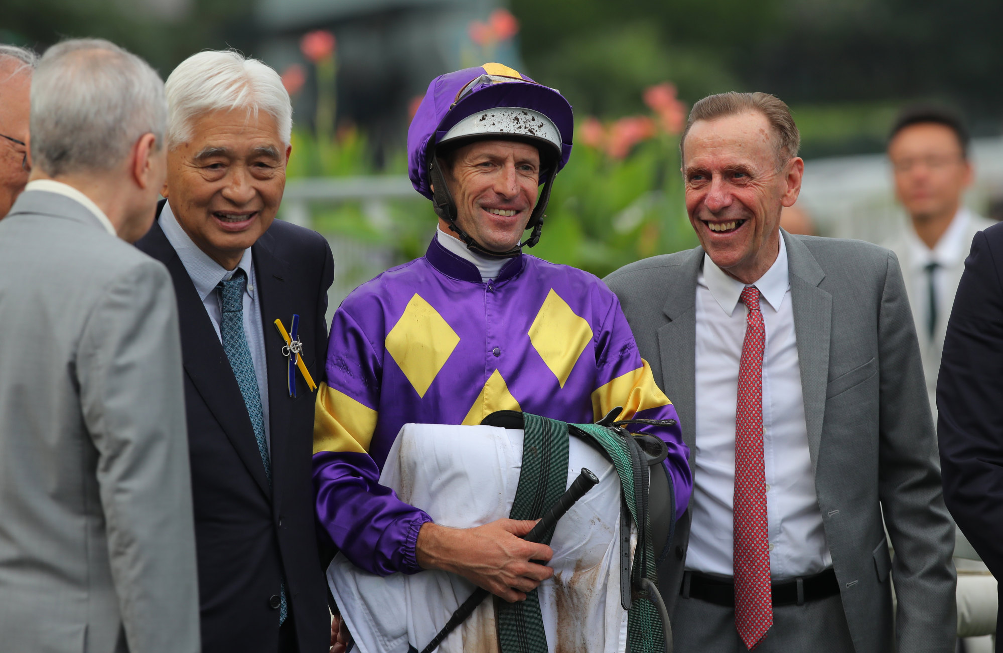 Jockey Hugh Bowman, trainer John Size (right) and connections of Helios Express celebrate.