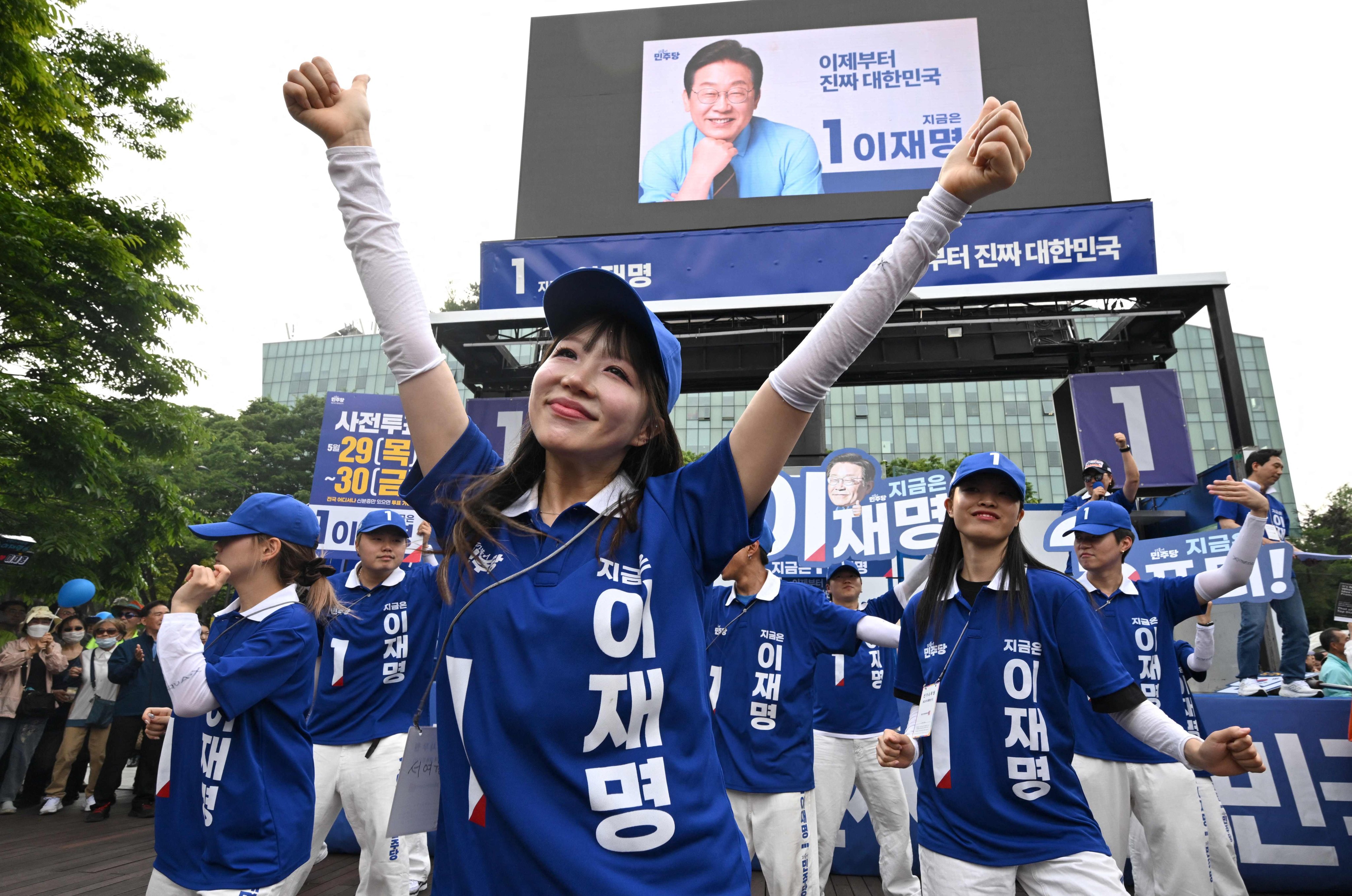 Supporters of South Korean presidential candidate Lee Jae-myung dance during an election campaign event on Wednesday. Photo: AFP