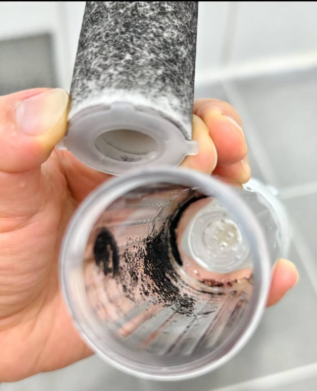 Black particles that have collected inside a water filter. Photo: Facebook/Desmond Wang