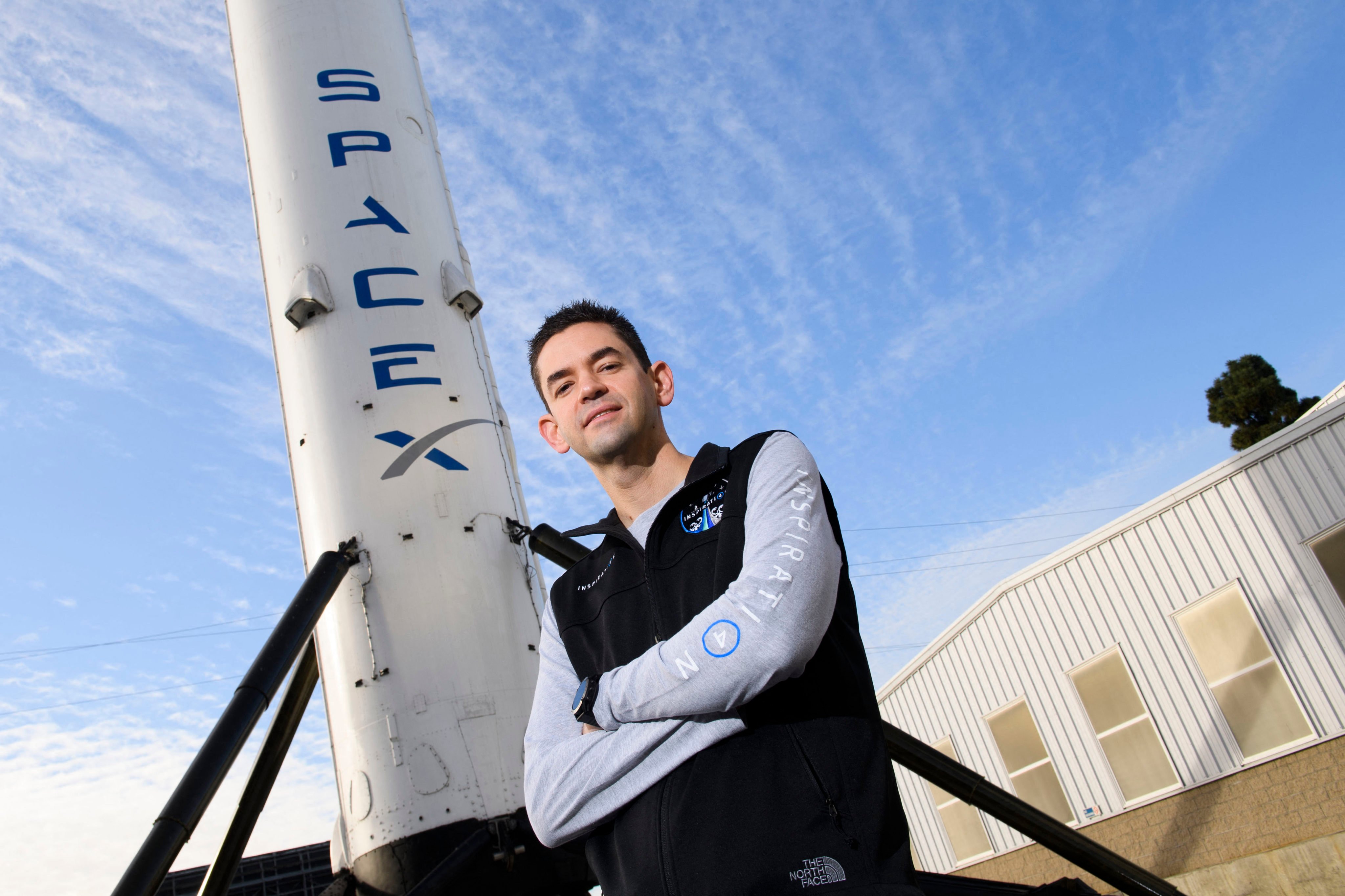 Jared Isaacman, founder and chief executive officer of Shift4 Payments, stands for a portrait in front of the recovered first stage of a SpaceX Falcon 9 rocket in Hawthorne, California, in February 2021. Photo: AFP