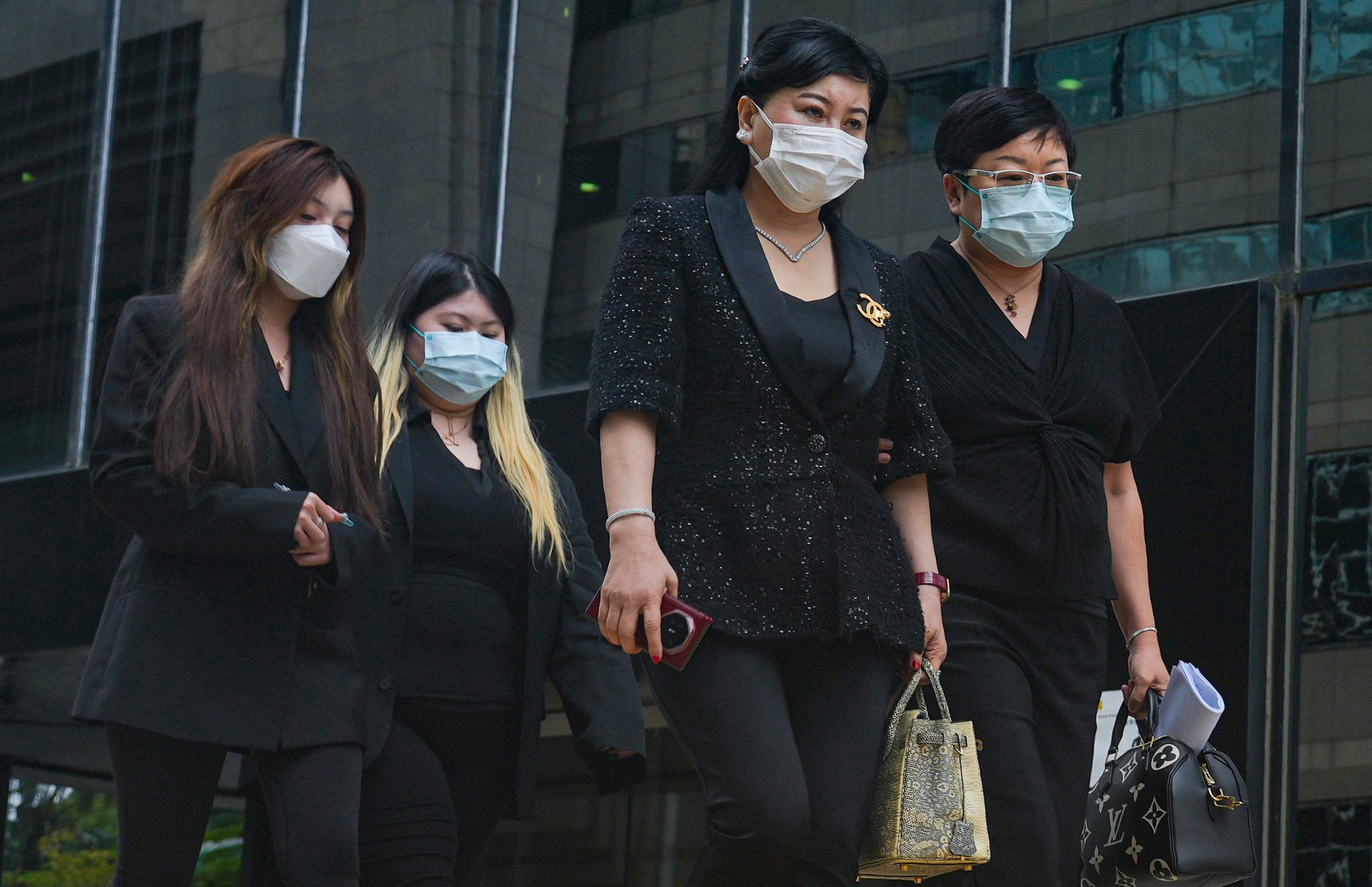 Abby Choi’s mother, Cheung Yin-fa (second right), appears at the District Court in Wan Chai on Monday. Photo: May Tse