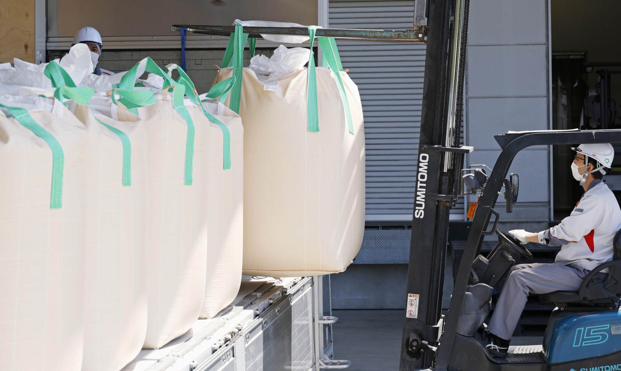 Rice stockpiles are delivered to Iris Ohyama’s rice polishing plant in Watari in Miyagi prefecture on Thursday. Photo: Kyodo Rice stockpiles are delivered to Iris Ohyama’s rice polishing plant in Watari in Miyagi prefecture on Thursday. Photo: Kyodo