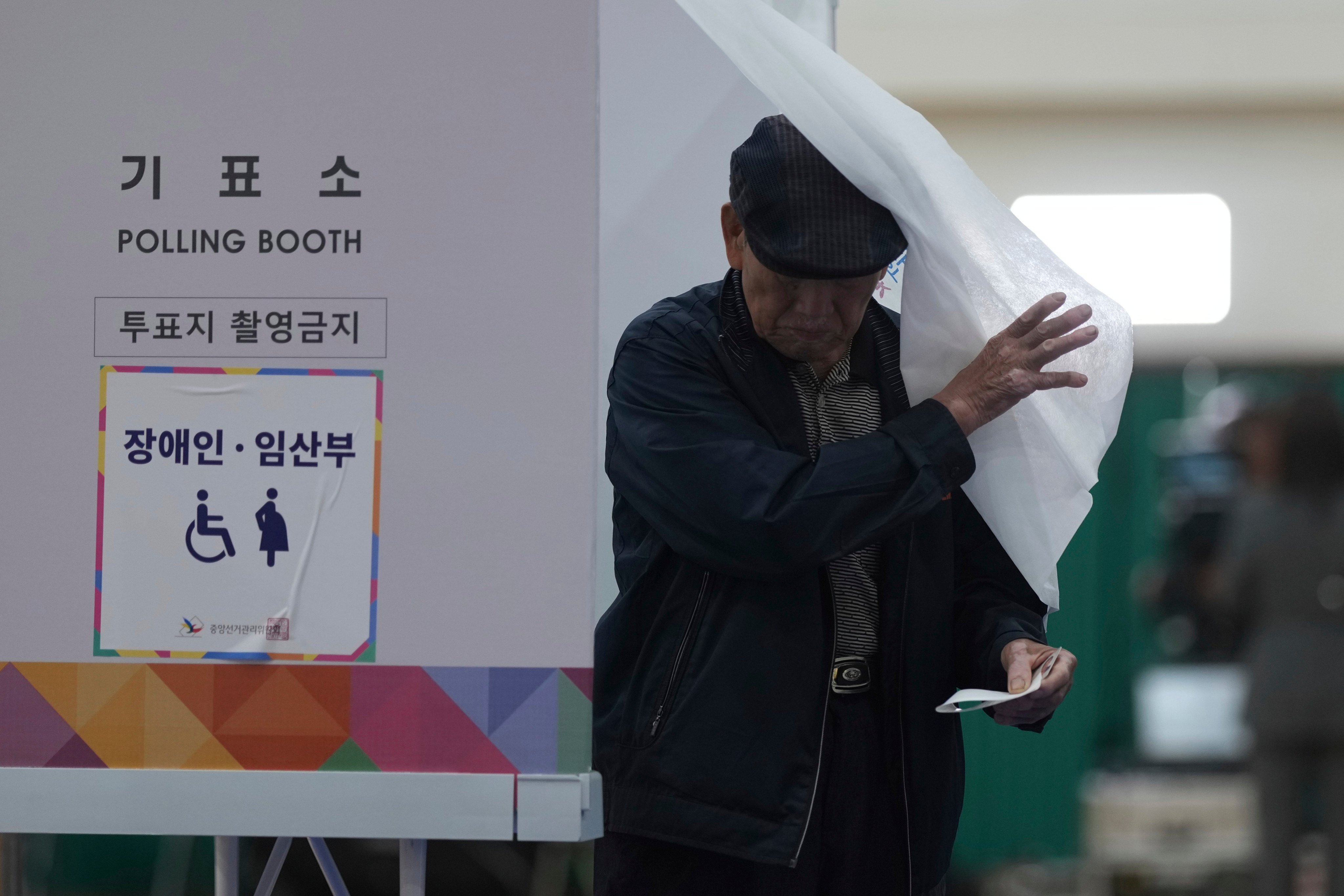 A man exits a polling booth to cast his ballot in South Korea’s presidential election in Seoul on Tuesday. Photo: AP