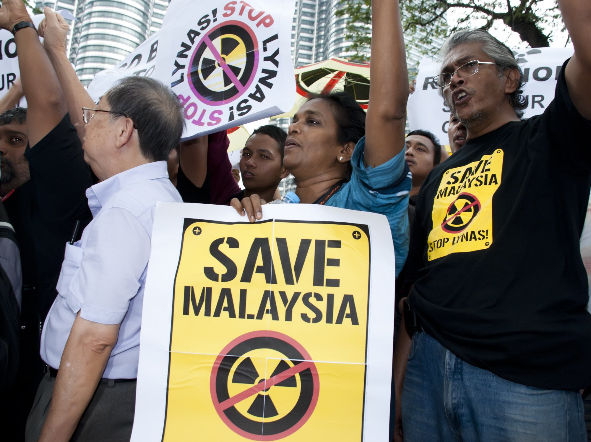 Demonstrators hold posters in front of Kuala Lumpur’s Petronas Twin Towers during a protest against Lynas’ earth plant. Photo: Shutterstock Demonstrators hold posters in front of Kuala Lumpur’s Petronas Twin Towers during a protest against Lynas’ earth plant. Photo: Shutterstock