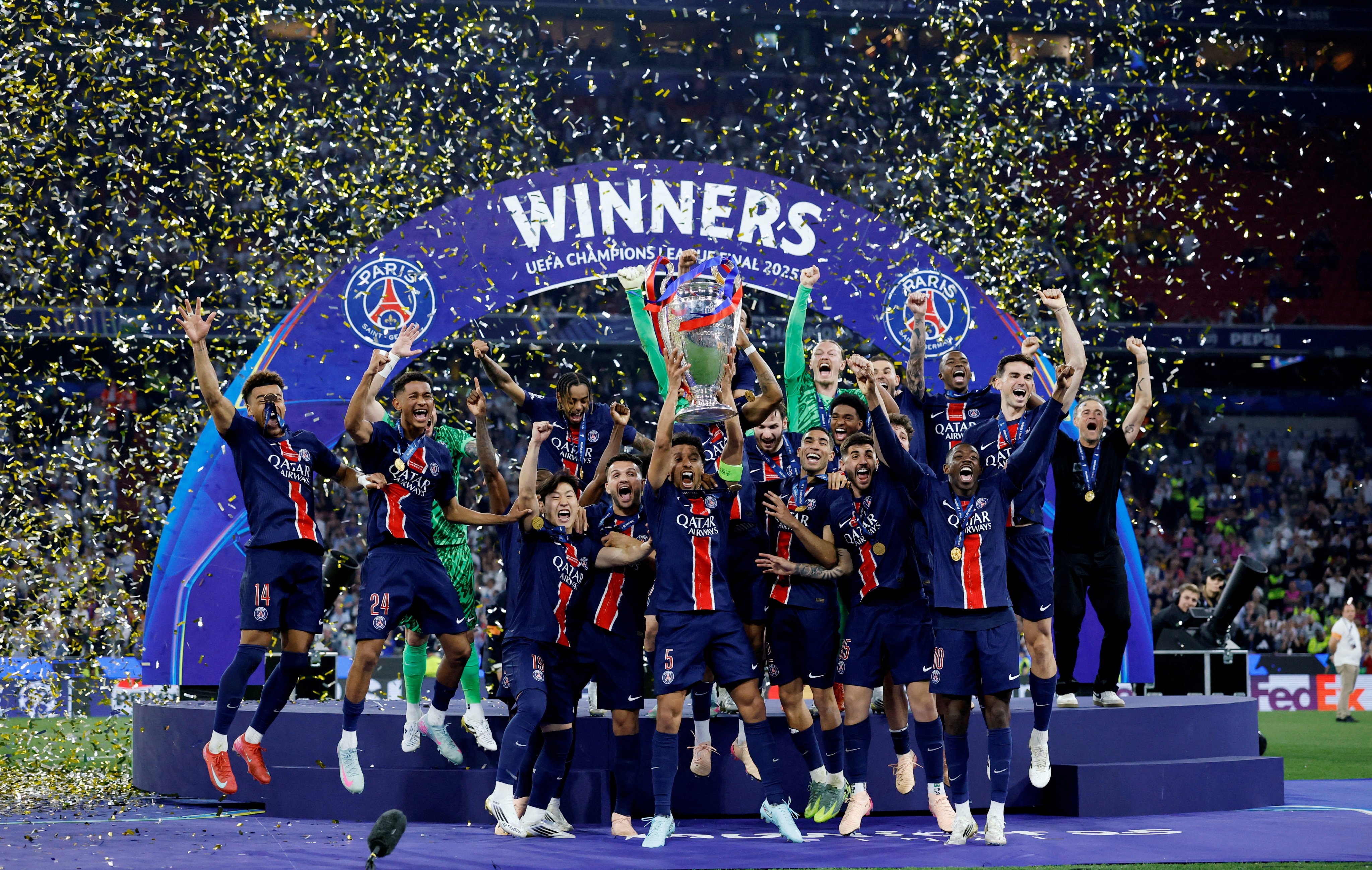Paris Saint Germain celebrate winning their first-ever Champions League final in Munich as captain Marquinhos holds aloft the trophy. Photo: Reuters