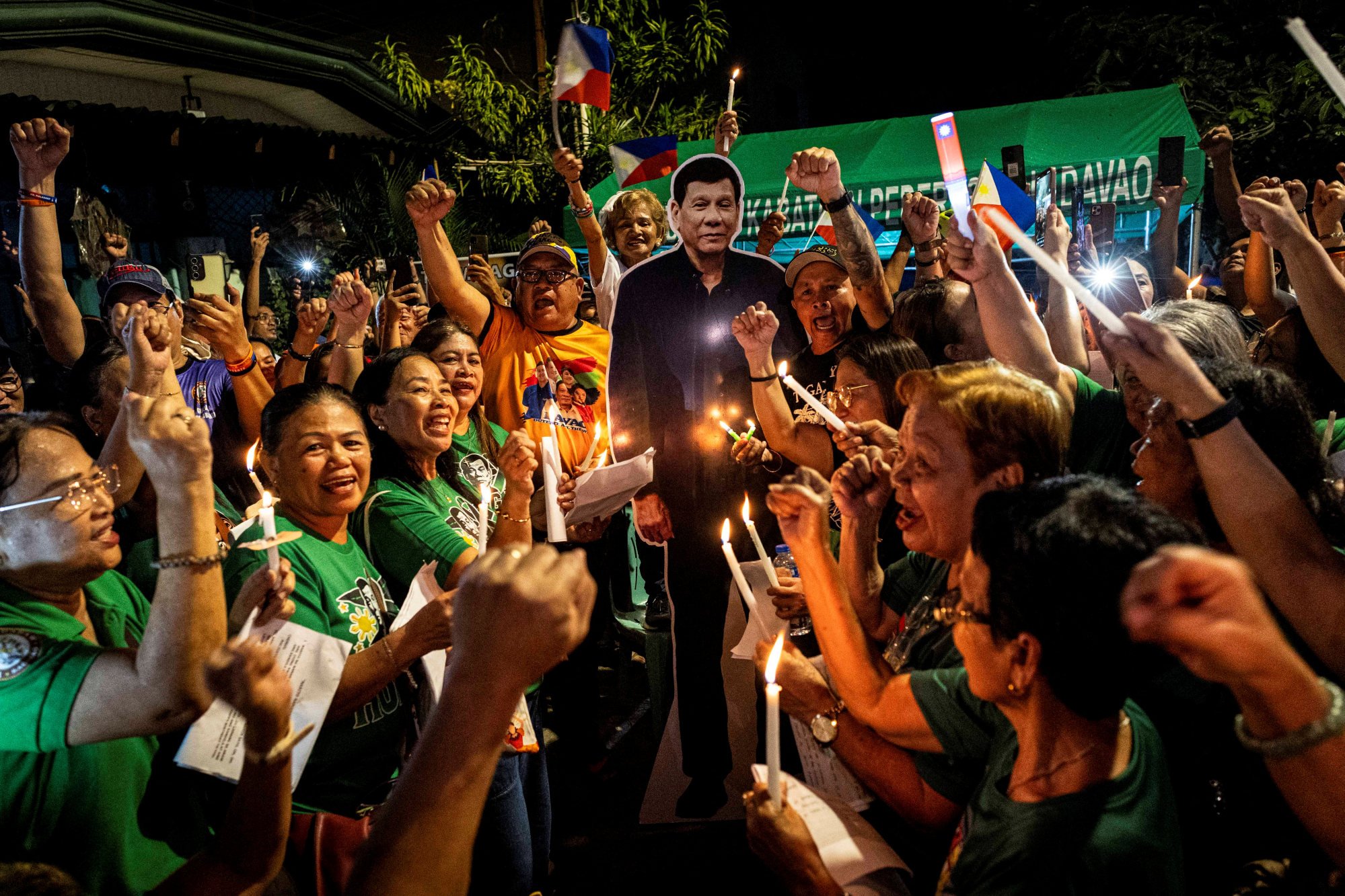 Supporters of the arrested former Philippine president Rodrigo Duterte celebrate his birthday outside his residence in Davao City on March 28. Photo: Reuters Supporters of the arrested former Philippine president Rodrigo Duterte celebrate his birthday outside his residence in Davao City on March 28. Photo: Reuters
