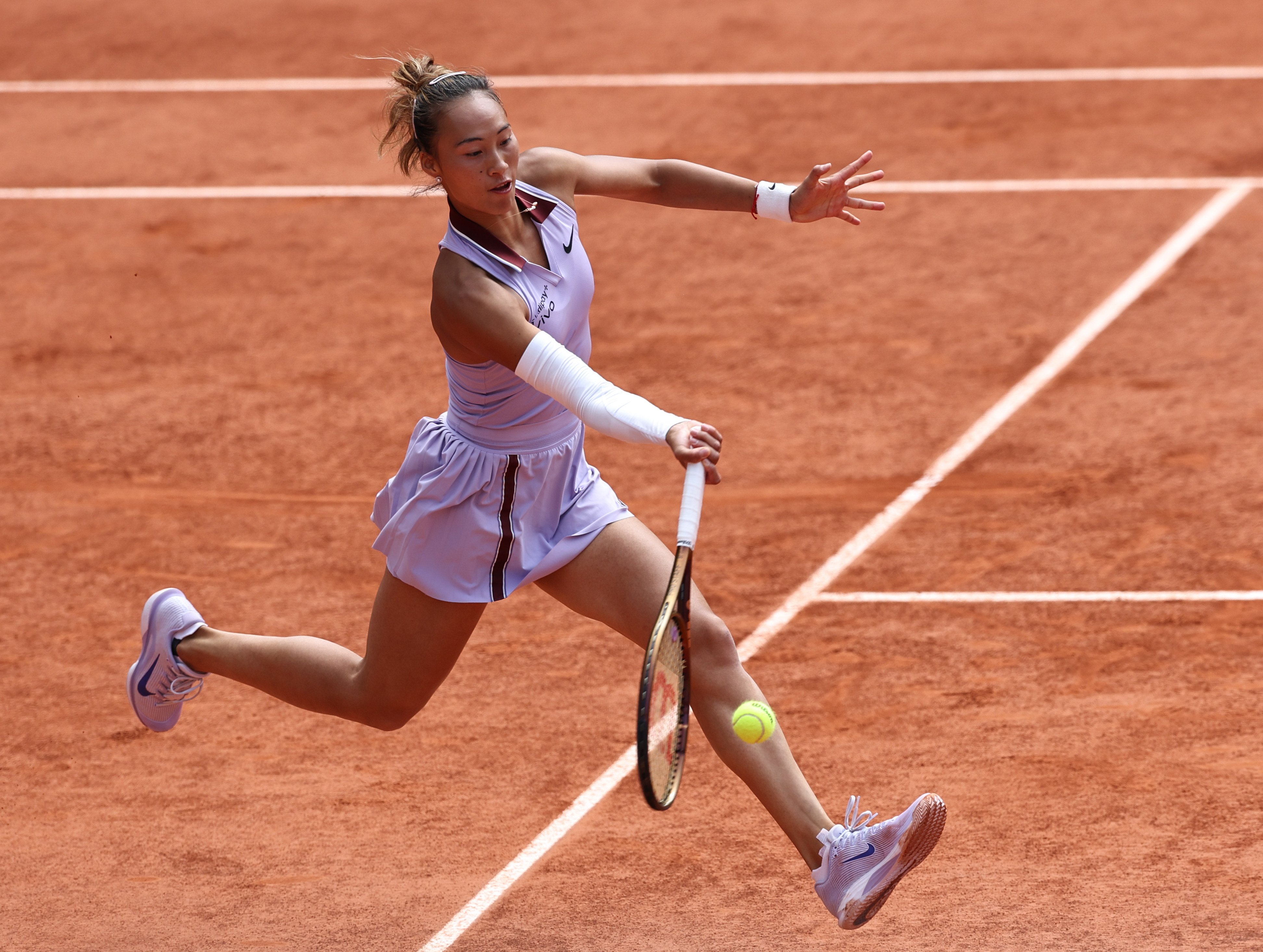 Zheng Qinwen hits a return during her French Open quarter-final defeat to Aryna Sabalenka. Photo: Xinhua