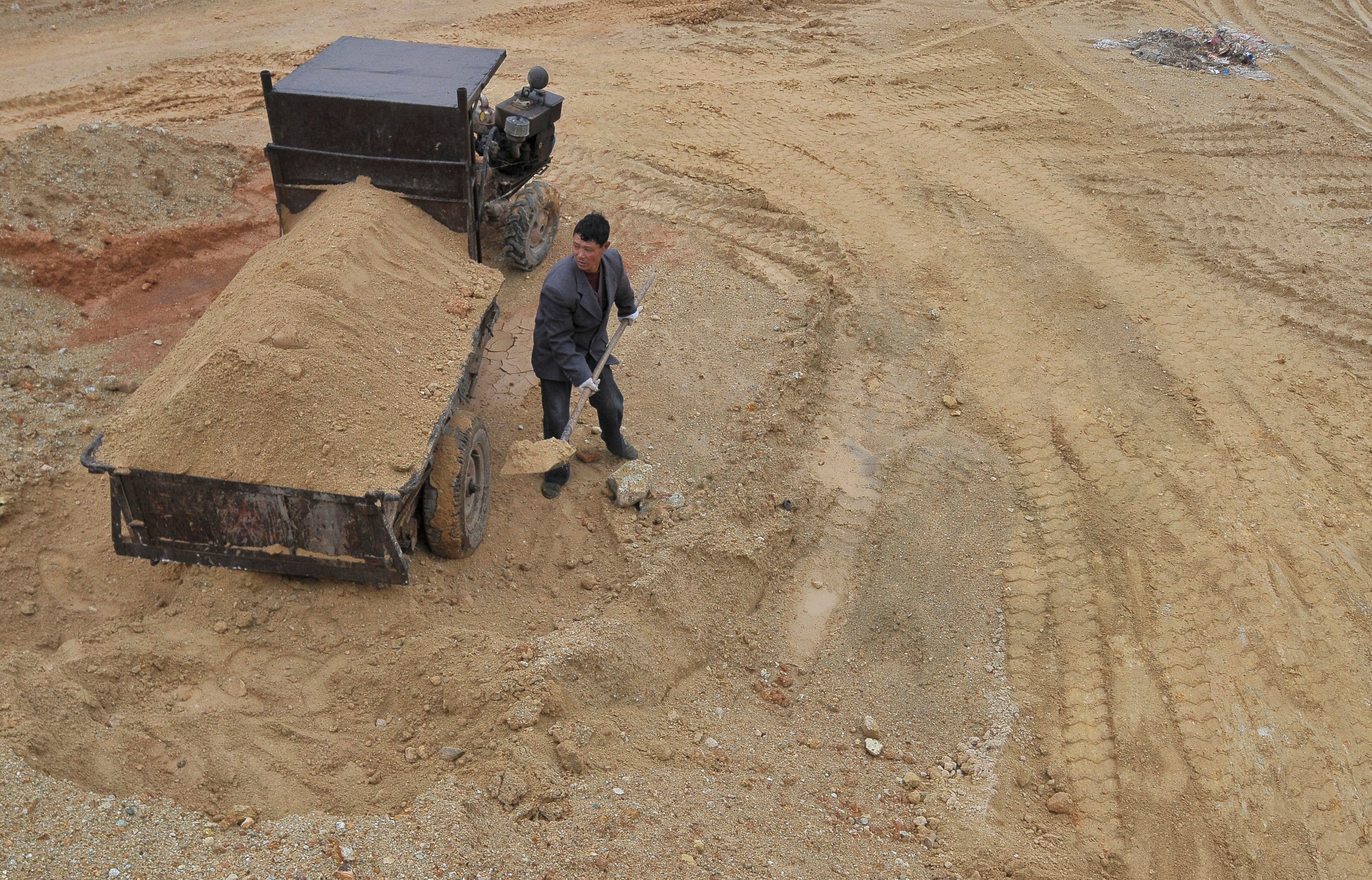 A labourer works at the site of a rare earth metals mine in Jiangxi province. Photo: Reuters