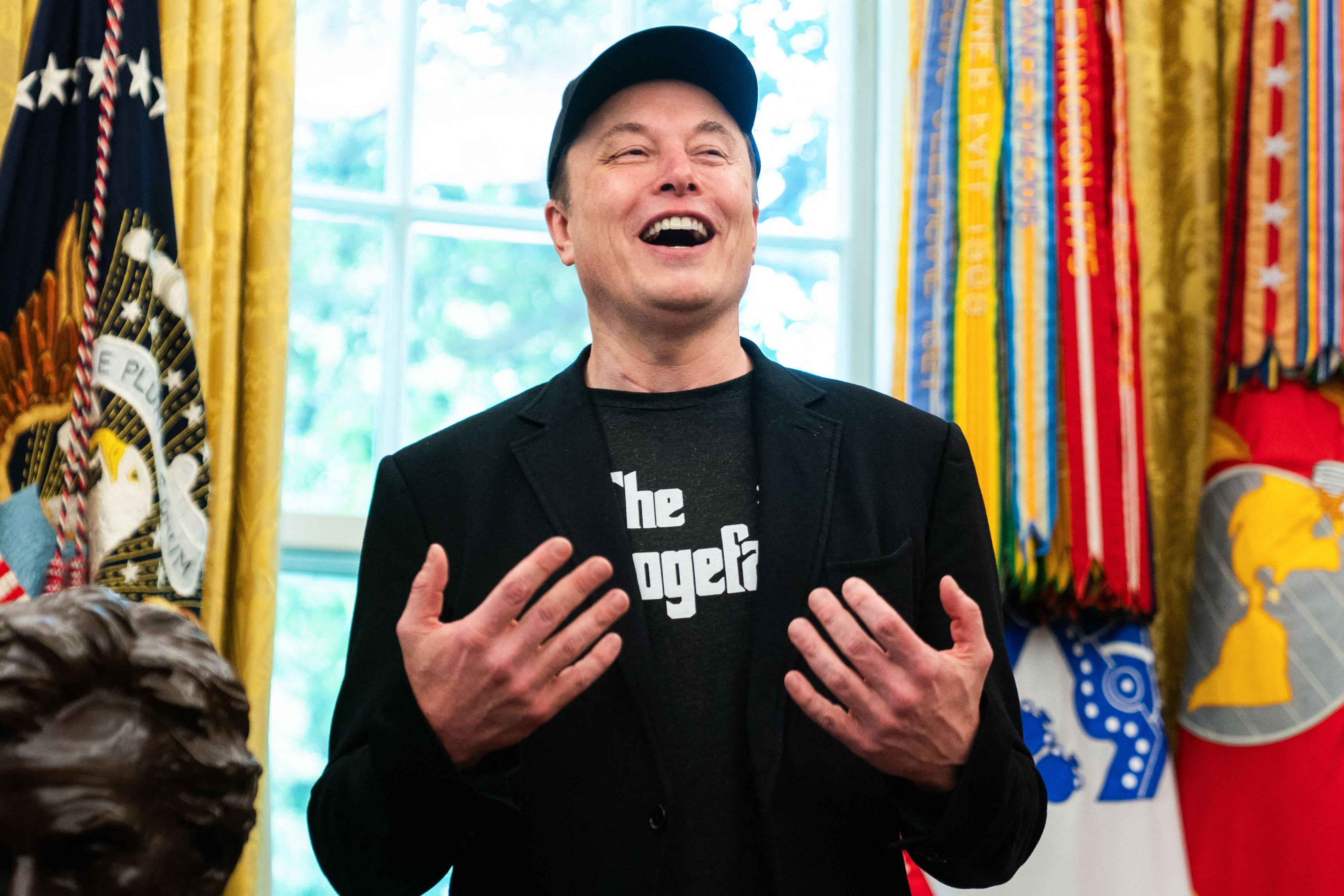 Elon Musk speaks during a news conference in the Oval Office on Friday. Photo: AFP