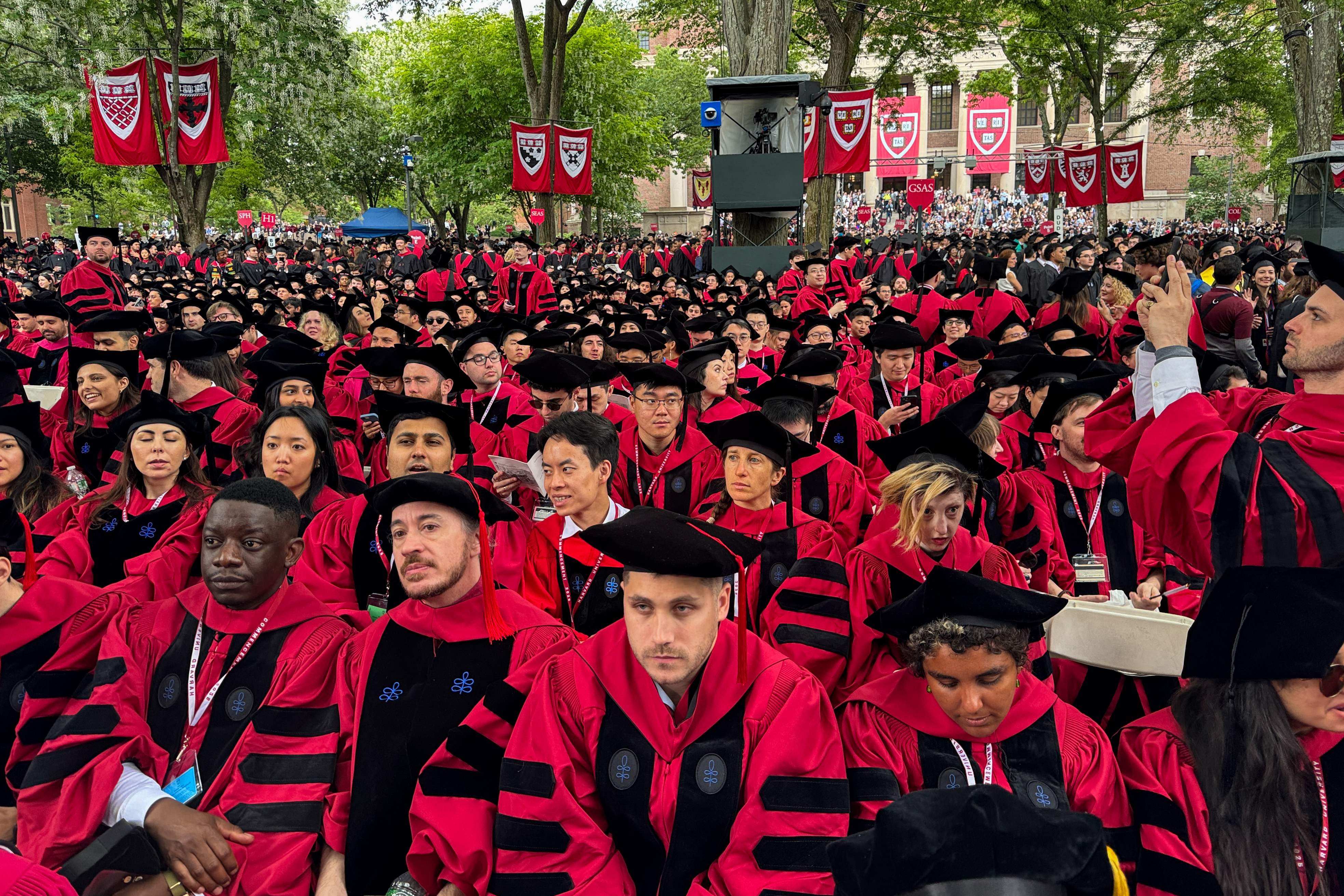 Graduates attend a commencement ceremony at Harvard University. US president Donald Trump has announced a ban on visas for foreign students who are set to begin attending Harvard. Photo: AFP