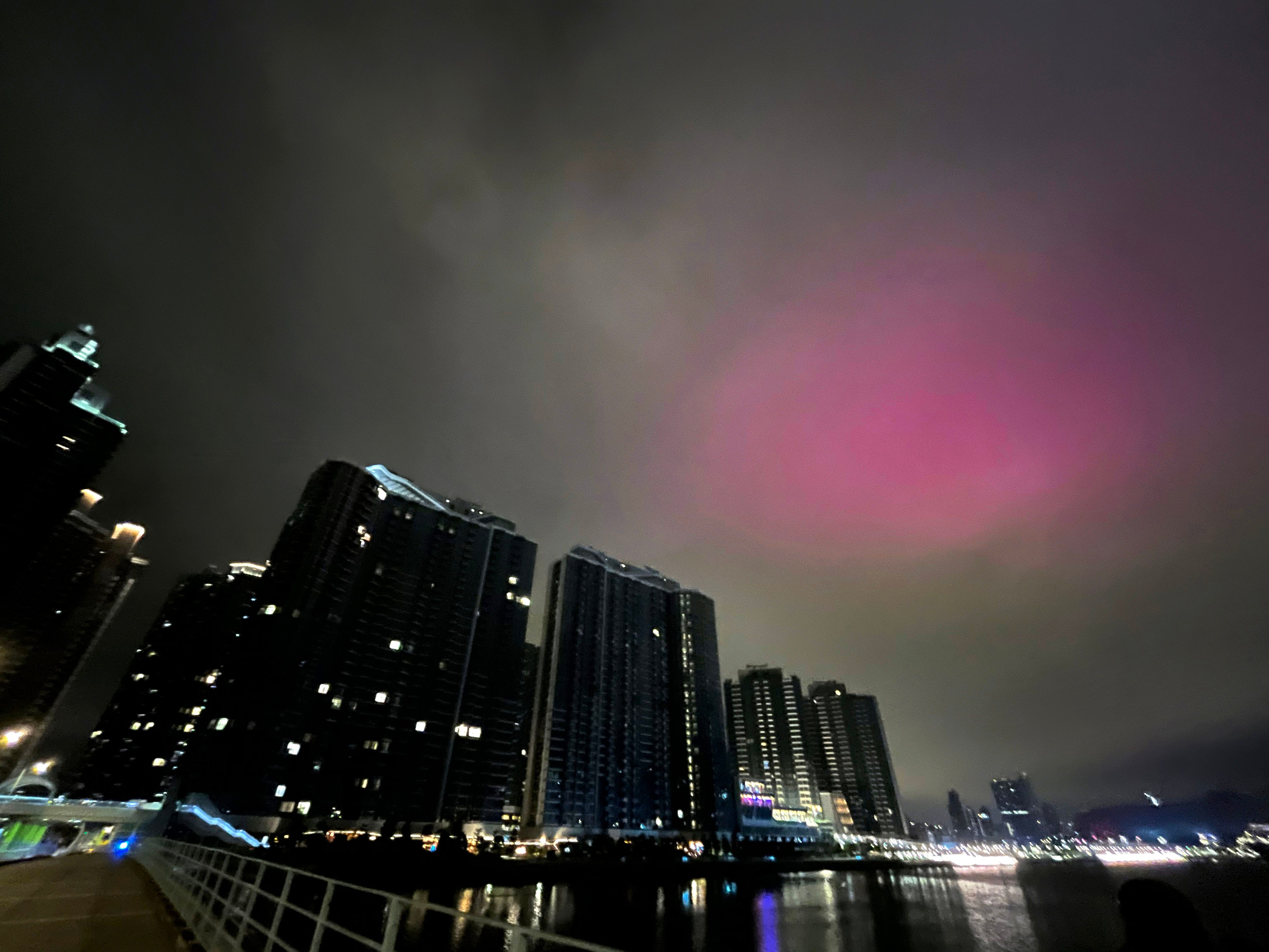 A pink glow fills the morning sky above Kai Tak. Photo:  Nora Tam