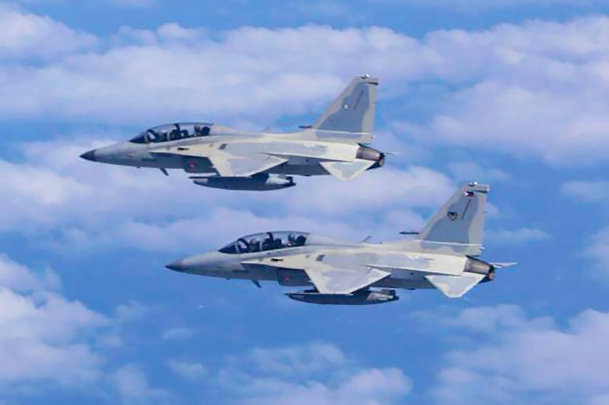 Two Philippine Air Force FA-50 fighter jets fly during a joint patrol and training session with the US over the South China Sea on February 4, 2025. Photo: Philippine Air Force/AP