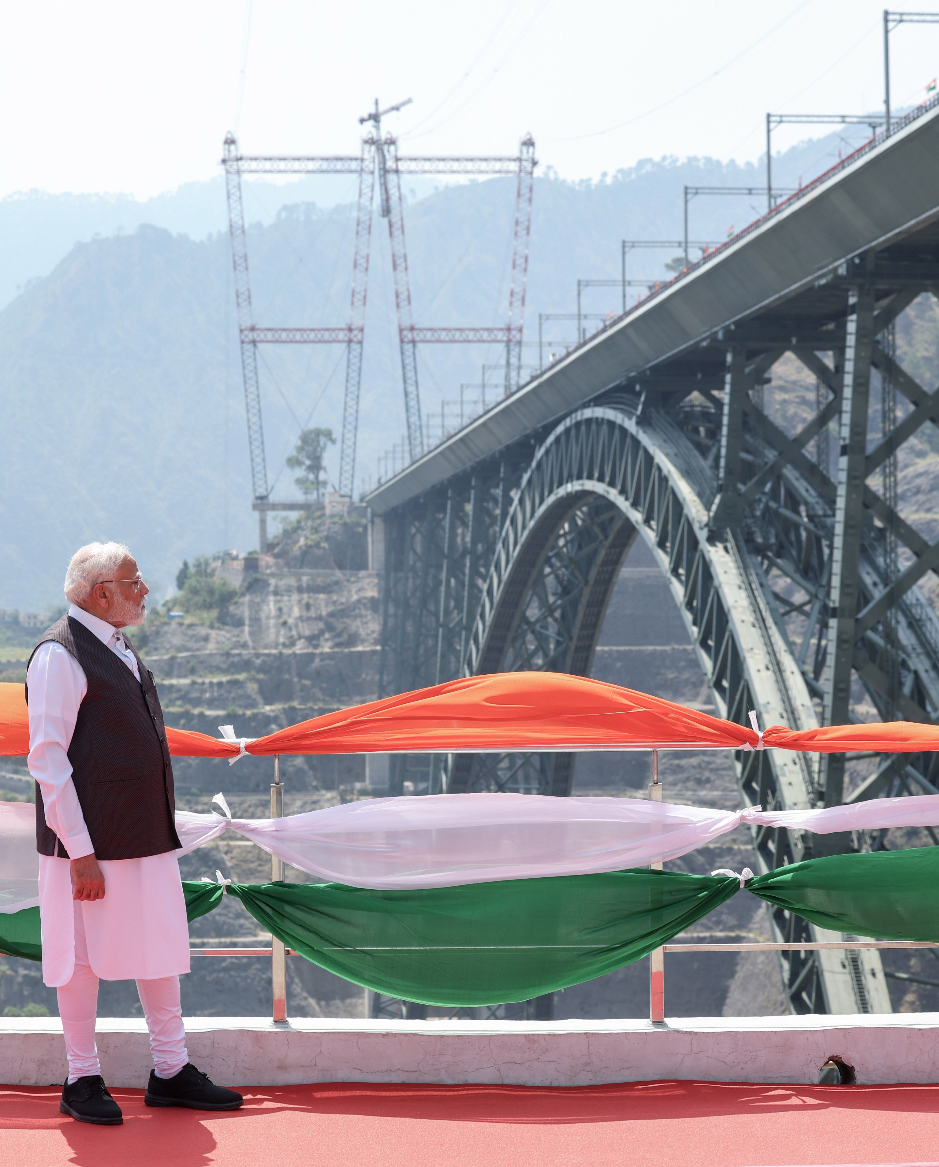 Indian Prime Minister Narendra Modi stands at a view point of the Chenab Bridge on Friday, after its inauguration. Photo: EPA-EFE