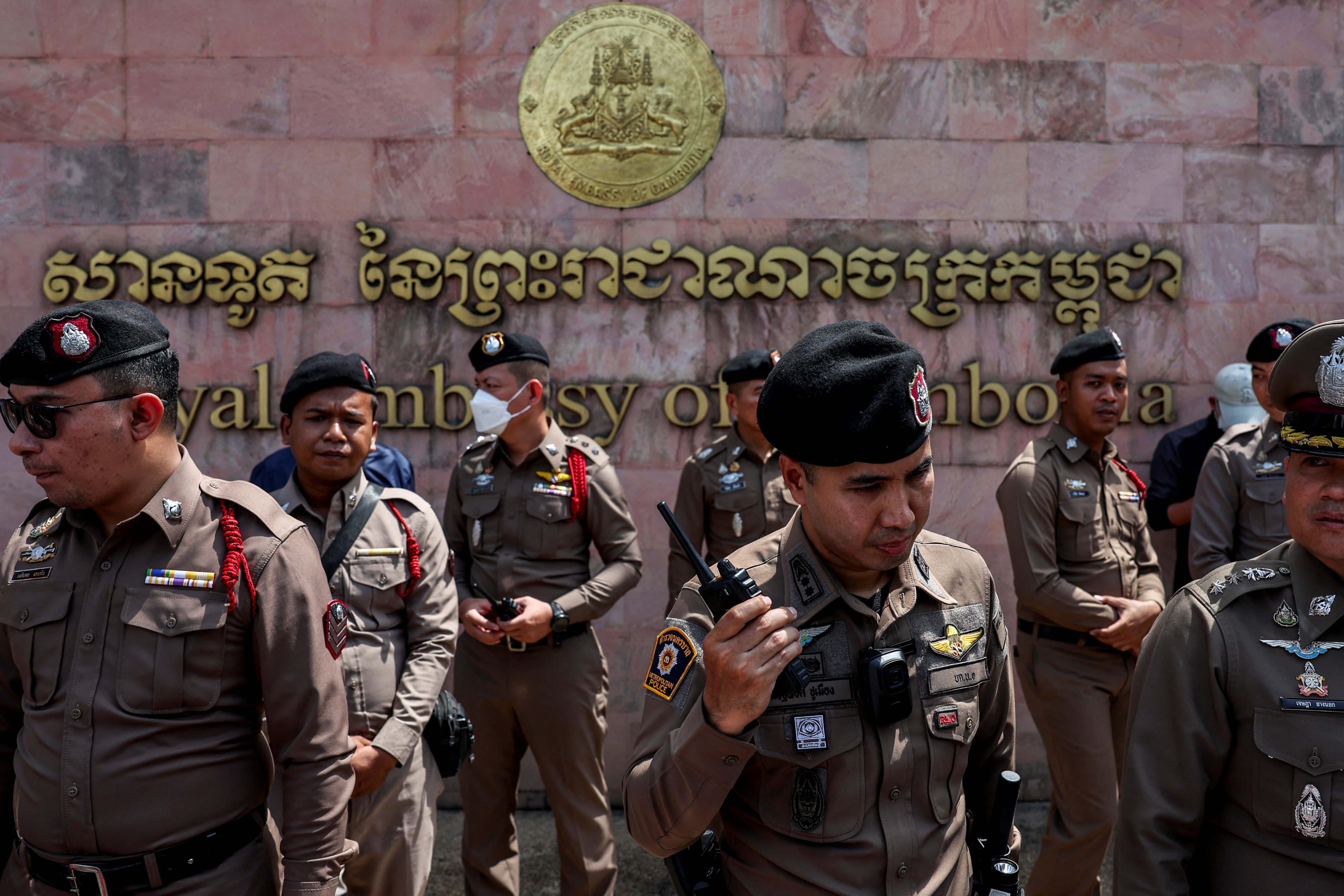 Thai police officers stand guard in front of the Cambodian embassy in Bangkok on Friday. Photo: Reuters