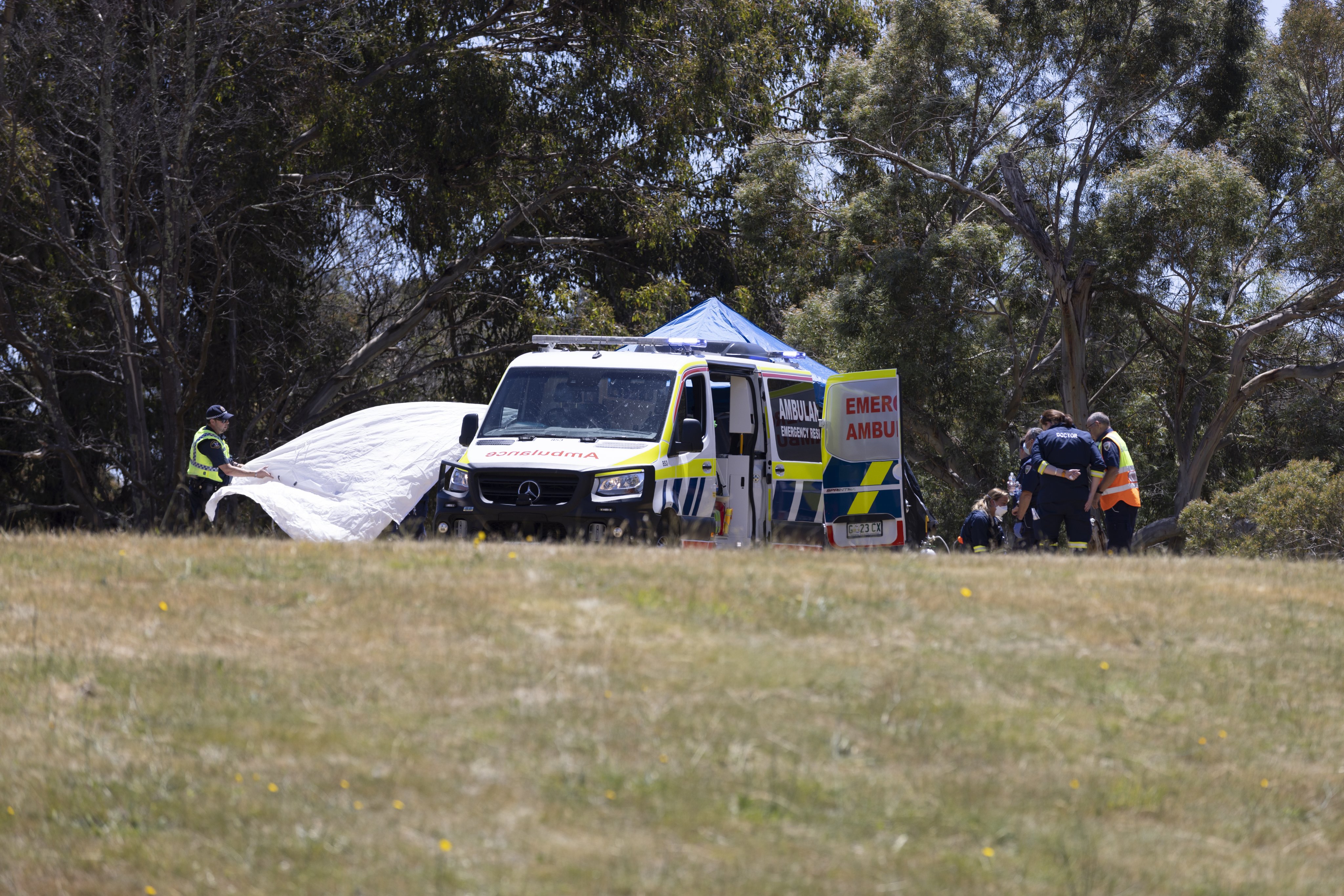Emergency services personnel on the scene at Hillcrest Primary School in Devonport, Tasmania, in December 2021 after a fatal accident involving a bouncy castle. Photo: EPA-EFE/