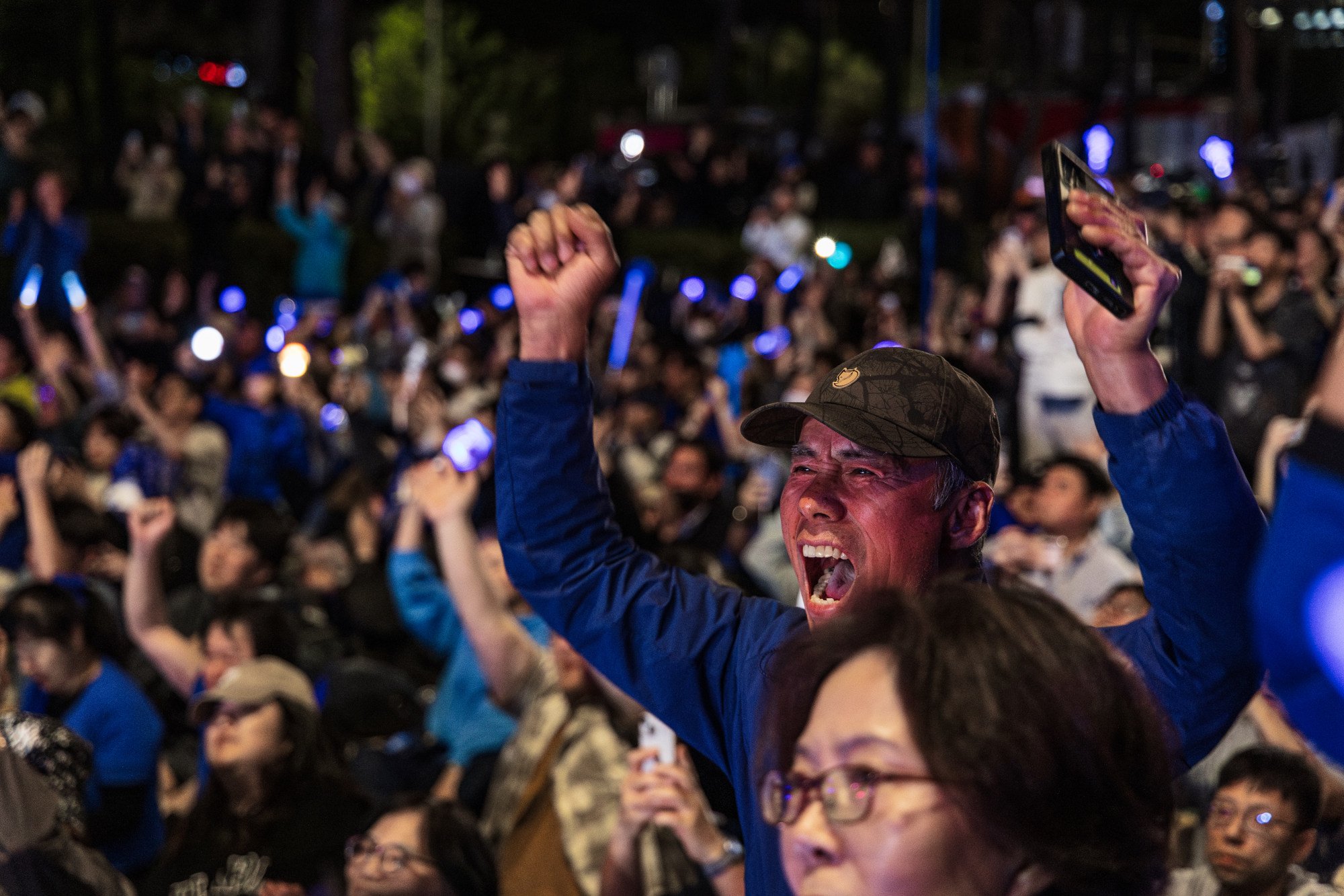 A Lee Jae-myung supporter cheers outside the National Assembly in Seoul on Tuesday, as the Democratic Party candidate is declared the winner of the 2025 presidential election. Photo: Kim Jung-yeop A Lee Jae-myung supporter cheers outside the National Assembly in Seoul on Tuesday, as the Democratic Party candidate is declared the winner of the 2025 presidential election. Photo: Kim Jung-yeop